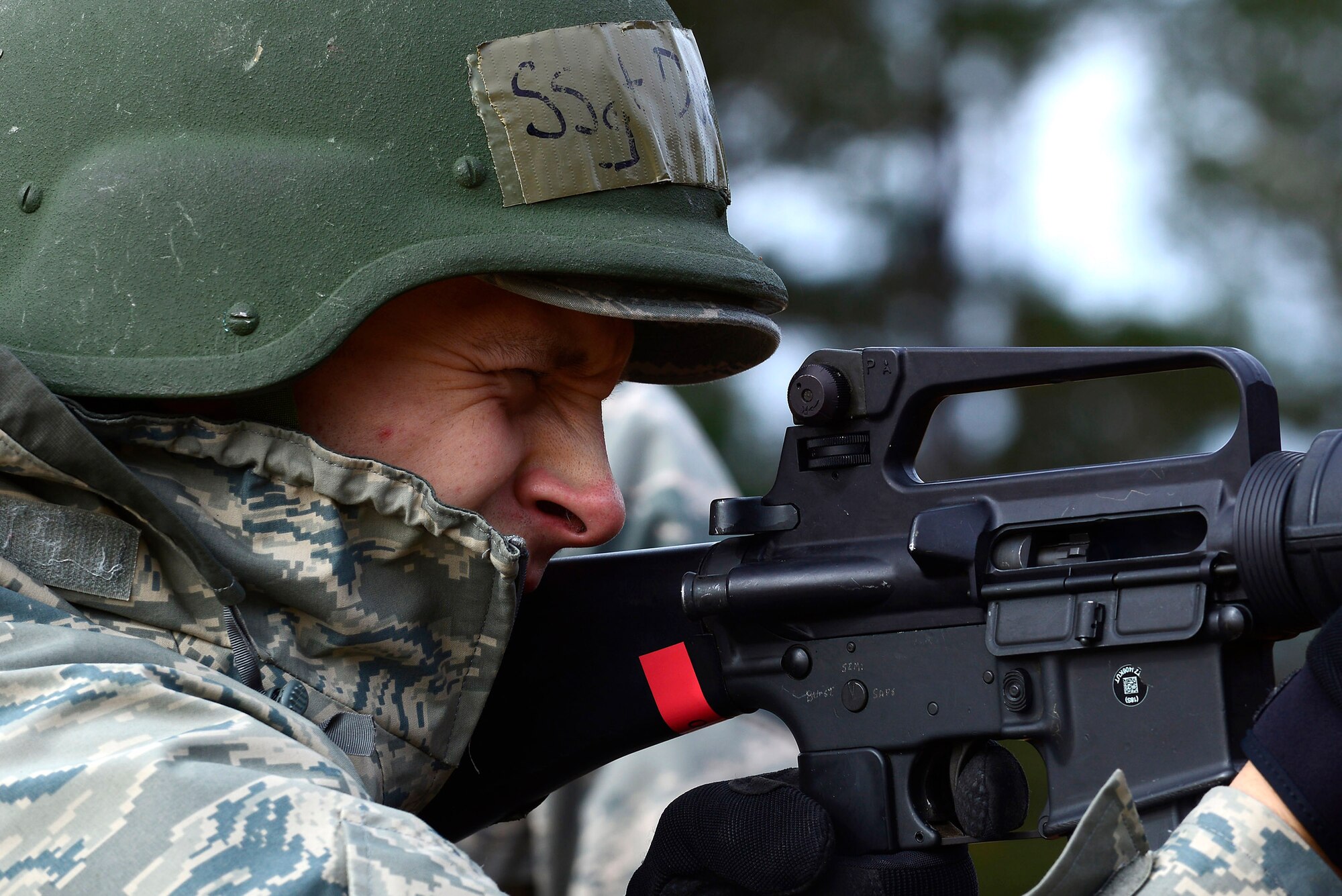A U.S. Air Force Airman returns fire in a simulated firefight during Operational Readiness Exercise Weasel Victory 15-01 at Shaw Air Force Base, S.C., Nov. 18, 2014. Airmen assigned to the 20th Civil Engineer Squadron were attacked by simulated opposition forces and forced to return fire until 20th Security Forces Squadron Airmen arrived to detain the attackers. (U.S. Air Force photo by Airman 1st Class Diana M. Cossaboom/Released)