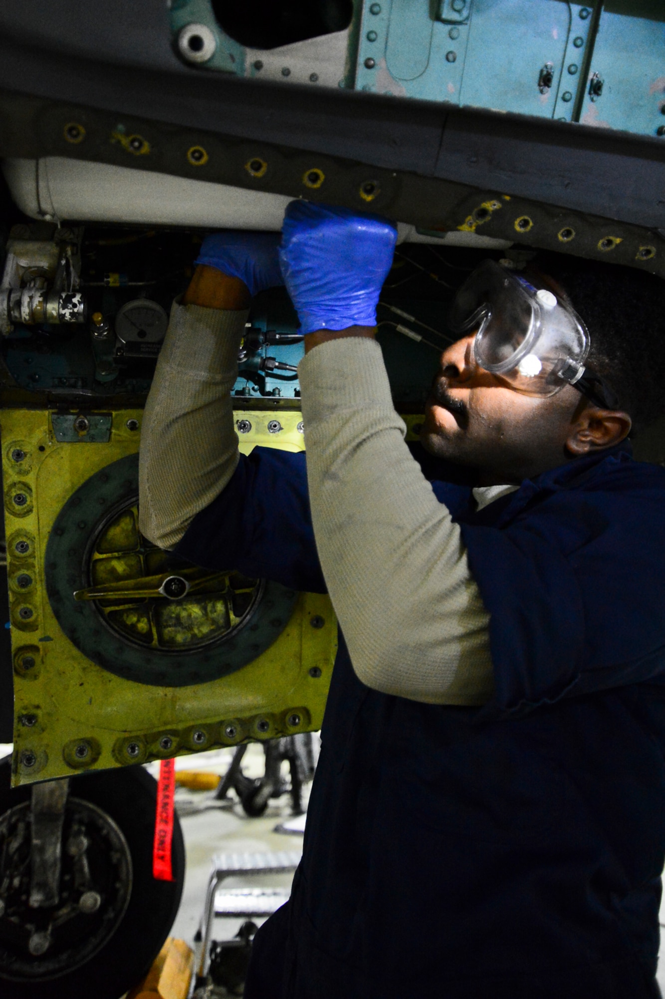 Senior Airman Branton Henderson, 48th Equipment Maintenance Squadron aircraft inspection section journeyman, performs routine maintenance on an F-15E Strike Eagle at Royal Air Force Lakenheath, England, Nov. 18, 2014. Henderson was nominated for a Liberty Spotlight because he displays the core value of Service Before Self. (U.S. Air Force photo by Airman 1st Class Erin R. Babis/Released)