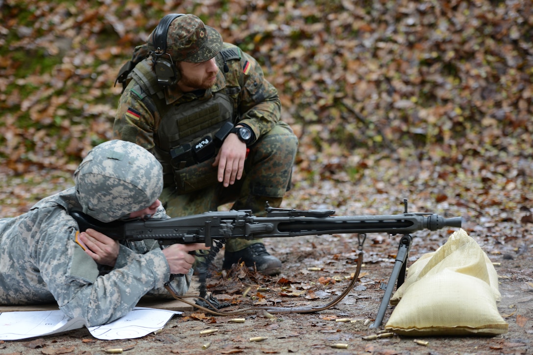 A U.S. soldier fires a Rheinmetall MG3 machine gun during the qualification for the German Armed Forces Badge for Weapons Proficiency on the Panzer Range Complex in Boeblingen, Germany, Nov. 19, 2014.
