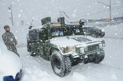 Members of the 105th MP Army National Guard provide traffic control in West Seneca, New York, Nov. 20, 2014. 