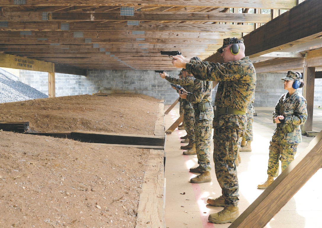 Marines take aim at updated targets during Combat Pistol Program qualifications at Marine Corps Logistics Base Albany’s pistol range, recently.