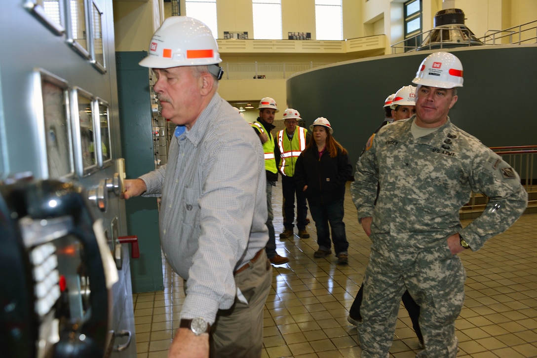 Jeff Flowers, power project manager at the Nashville District Mid-Cumberland Area Construction Office, discusses the functions of the control room at the Center Hill Power Plant to the Great Lakes and Ohio River Division commander, Brig. Gen. Richard G. Kaiser on Nov. 19, 2014.  