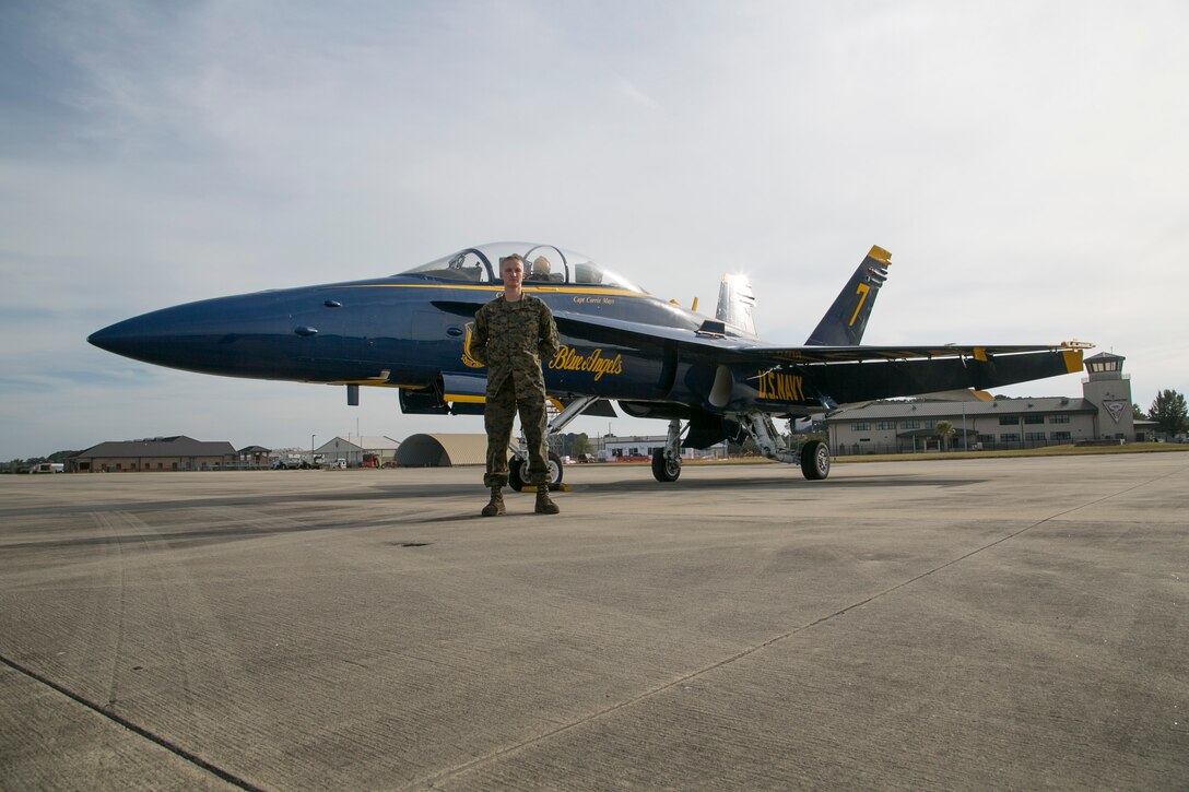 Sergeant Casey Hourigan , an airframes mechanic with Marine Fighter Attack Squadron 312 aboard Marine Corps Air Station Beaufort, checks into the Navy Flight Demonstration Squadron, also known as the Blue Angels, in Pensacola, Fla., Dec. 8.