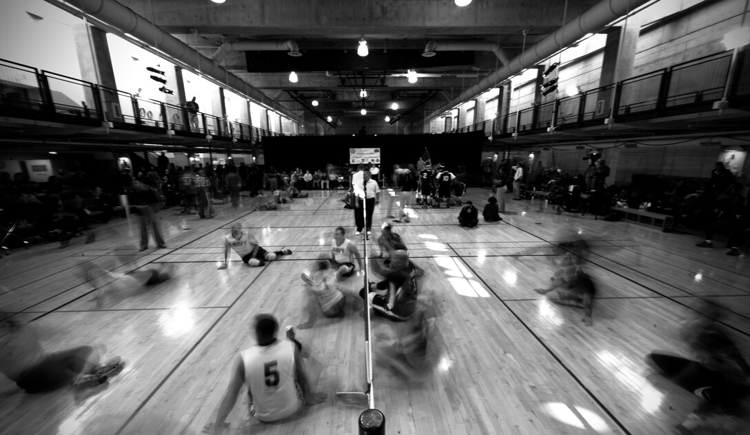 The Air Force competes against the Navy for 3rd place during the 4th Annual Pentagon Sitting Volleyball Tournament Navy Nov. 20, 2014, at the Pentagon Athletic Club.  The one-day tournament is designed to bring awareness to the challenges of the wounded, ill or injured population. (U.S. Air Force photo/Staff Sgt. Anthony Nelson Jr.)