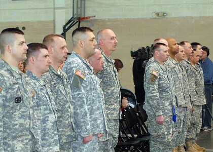 Members of the OMLT III of the Minnesota National Guard stand at attention during their deployment ceremony March 1, 2010. The following day, they left for training at Ft. Polk and will deploy with the Croatian Armed Forces to Afghanistan for about a year.