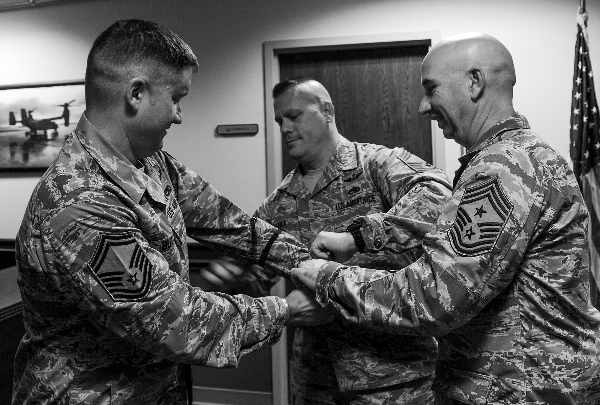 Senior Master Sgt. Loren Butts, 8th Special Operations Squadron, receives his Chief Master Sgt. stripes from members of the Chiefs Group at Hurlburt Field, Fla., Nov. 20, 2014. The Chiefs Group drove around Hurlburt to congratulate 15 chief selects. (U.S. Air Force photo/Senior Airman Christopher Callaway