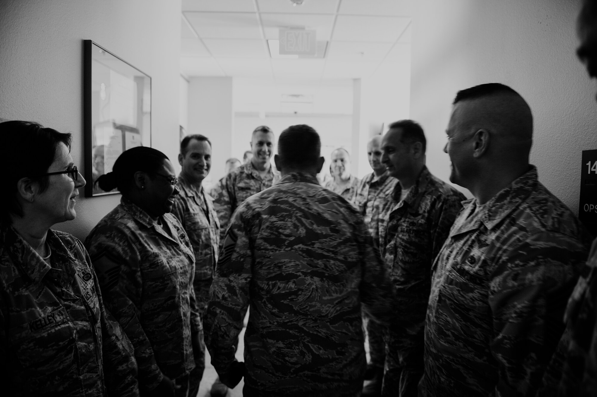 A Senior Master Sgt. is congratulated by members of the Chiefs Group on his promotion to Chief Master Sgt. at Hurlburt Field, Fla., Nov. 20, 2014. The Chiefs Group drove around Hurlburt to congratulate 15 chief selects. (U.S. Air Force photo/Senior Airman Christopher Callaway)
