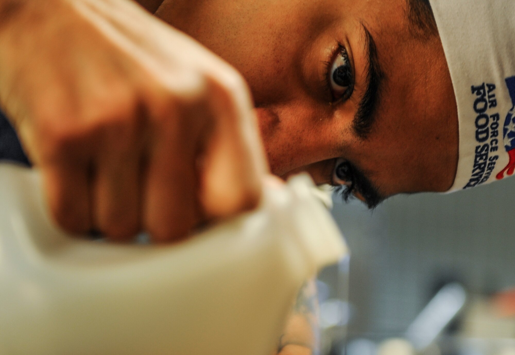 Airman Cameron Johnson, 1st Special Operations Force Support Squadron food services journeyman, measures syrup for a lunch time dish at the Reef Dining Facility on Hurlburt Field, Fla., Nov. 21, 2014. The Reef is open for breakfast, lunch and dinner, and any Department of Defense cardholder may eat there. (U.S. Air Force photo/Senior Airman Christopher Callaway)