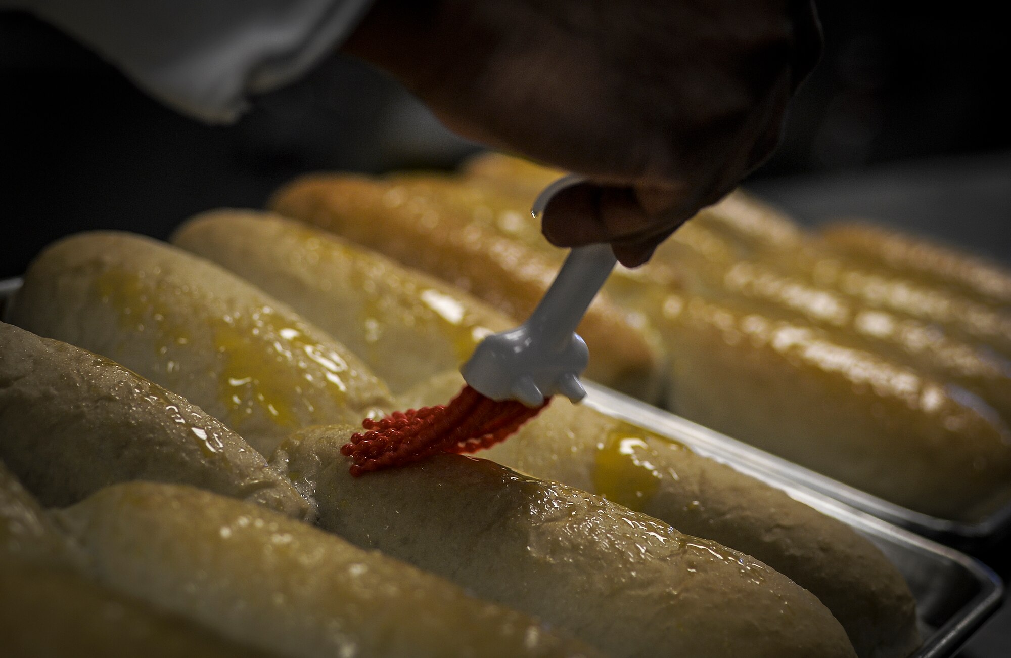 Bread is buttered at the Reef Dining Facility on Hurlburt Field, Fla., Nov. 12, 2014. (U.S. Air Force photo/Senior Airman Christopher Callaway)
