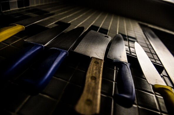 Knives hang on a wall at the Reef Dining Facility on Hurlburt Field, Fla., Nov. 21, 2014. Food service journeymen from the 1st Special Operations Force Support Squadron use various utensils to prepare breakfast, lunch and dinner for Air Commandos.