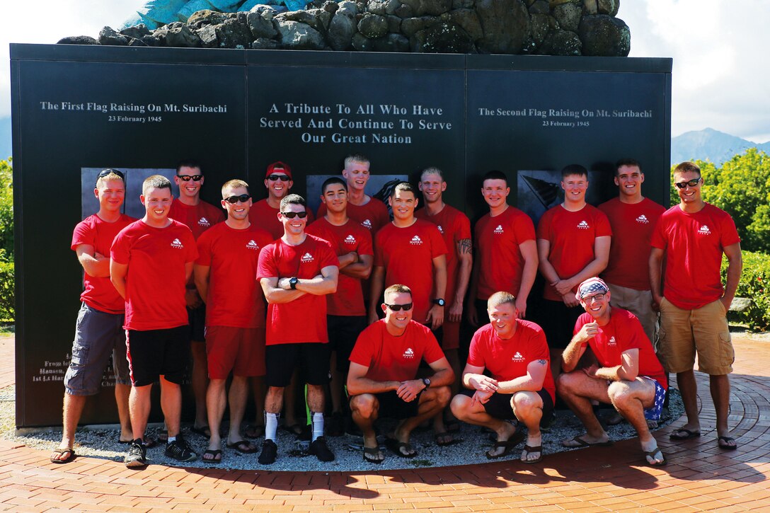 MARINE CORPS BASE HAWAII - Marines gather around the Pacific War Memorial to pose for a photo after finishing their run in support of the Semper Fi Fund on Nov. 15, 2014. The Marines finished the run using partners, each runner rotating around every 3 miles — and each having run around 15 miles in a 24-hour period. (U.S. Marine Corps photo by Pfc. Harley Thomas)