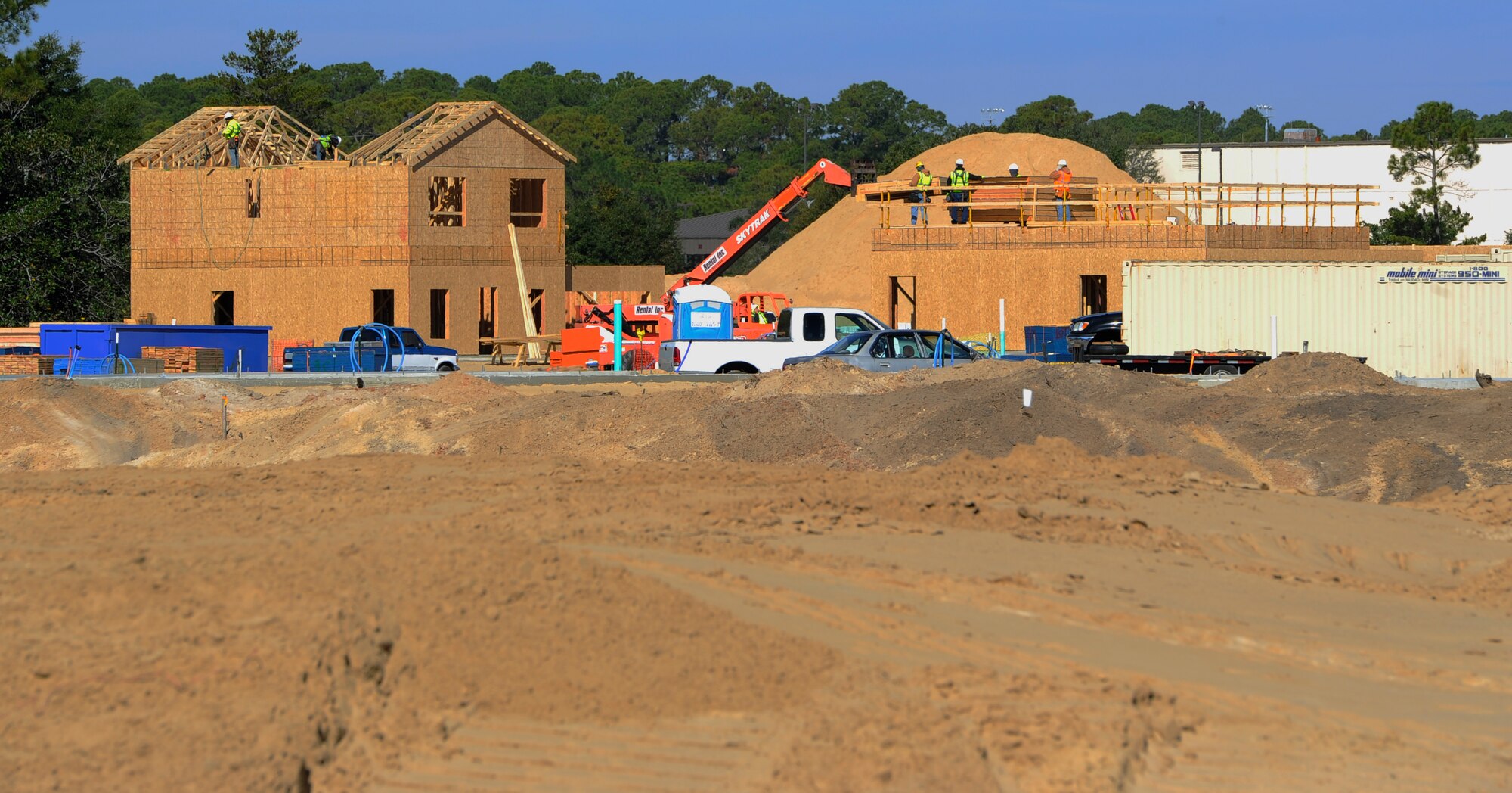 Vertical construction on three new homes takes place at the Osprey Landing Neighborhood on Hurlburt Field, Fla., Nov. 18, 2014. Construction workers started framework on three of the 63 houses projected to be built in the neighborhood. (U.S. Air Force photo/Staff Sgt. Sarah Hanson)