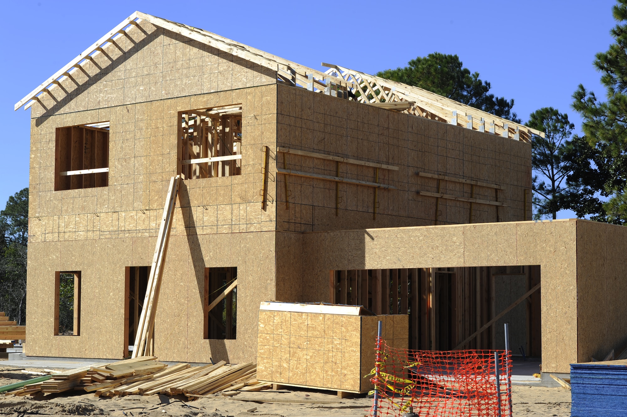 Framing begins on three new houses at the Osprey Landing Neighborhood on Hurlburt Field, Fla., Nov. 18, 2014. “We’ve been working on these plans for years, but to actually see [a house] standing is very rewarding,” said Bob McDonald, Corvias Military Living, Director of Construction. (U.S. Air Force photo/Staff Sgt. Sarah Hanson)