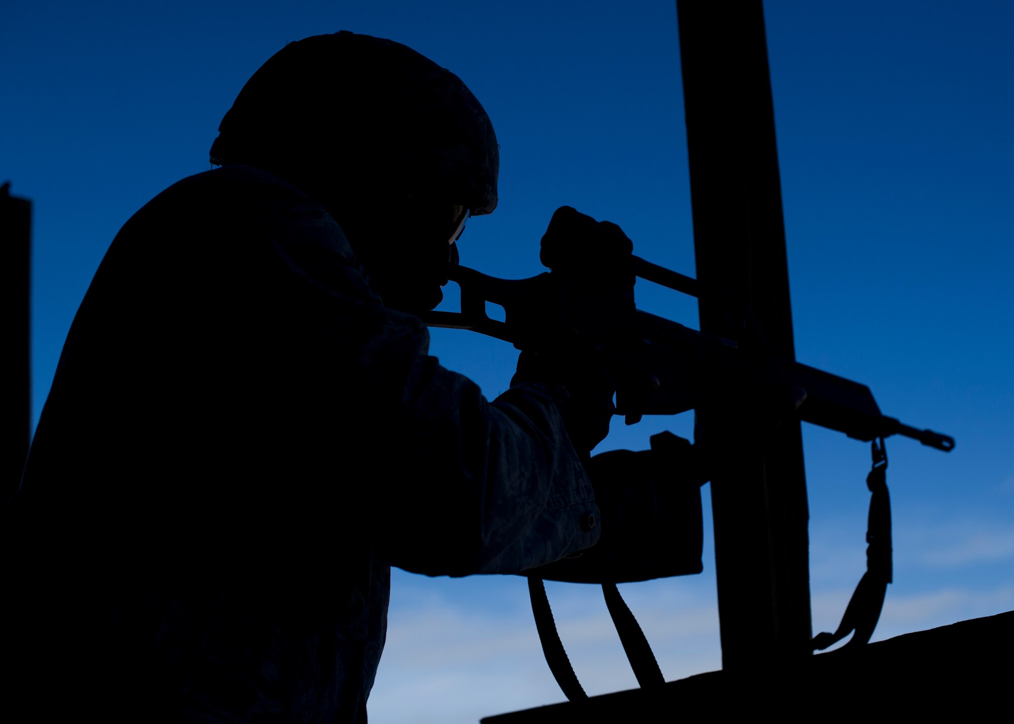 A member of the 49th Security Forces Squadron fires the German G36 Assault Rifle at Holloman Air Force Base, N.M., Nov. 12. Holloman Airmen and the German Air Force came together at the Combat Arms and Maintenance facility for weapons qualification to enhance an already established bond. Each Air Force had an opportunity to fire each other’s weapons with the chance of earning the Air Force Marksmanship Ribbon, or the German Air Force Marksmanship Badge, Schutzenschnur. (U.S. Air Force photo by Senior Airman Leah Ferrante/released)