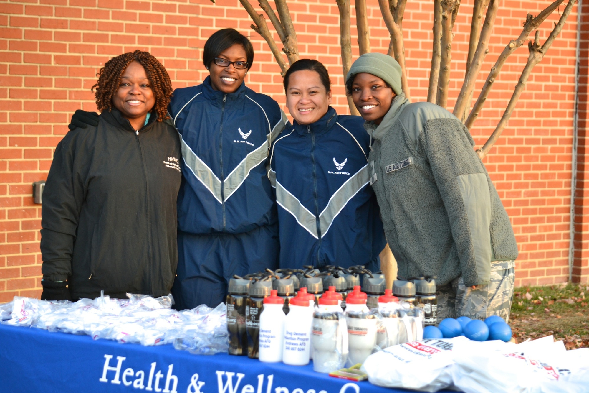 Ms Goff,  Tech. Sgt. Millicent Cavazos, Tech. Sgt. Tina Phelps-Prince, Staff Sgt.
Candace Moyd reached out to individuals attending the Great American Smoke Out/Turkey Trot run to hand them information on how to stop smoking. (photo by (AF Photo by Master Sgt. Aimee Klarmann)
