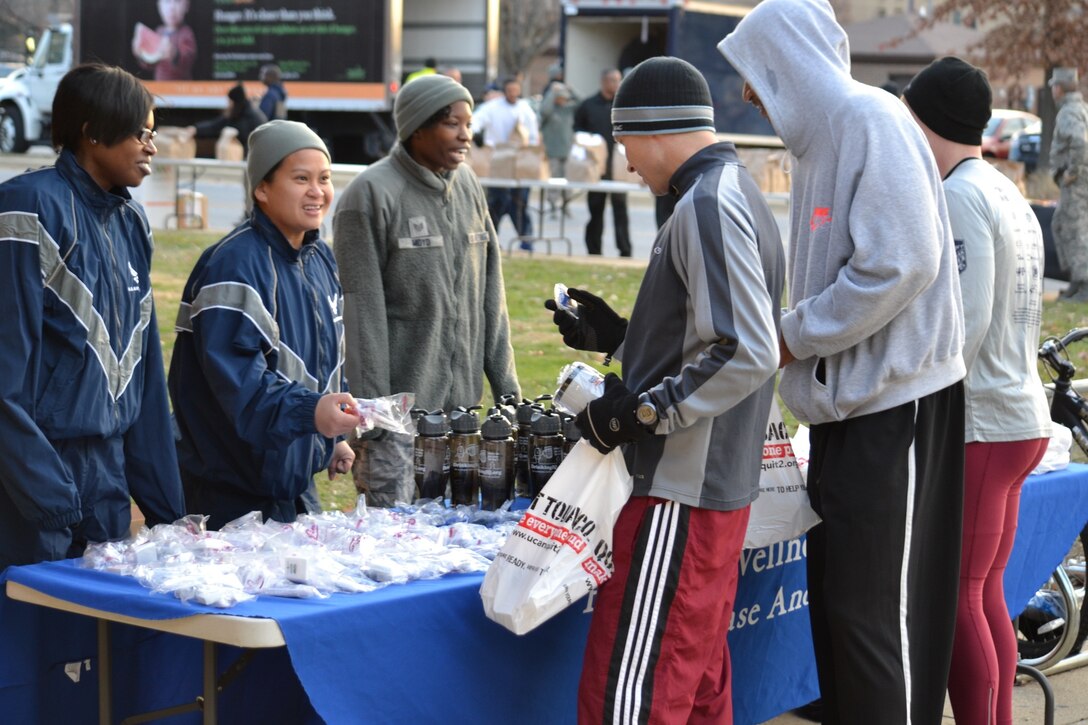 Ms Goff,  Tech. Sgt. Millicent Cavazos, Tech. Sgt. Tina Phelps-Prince, Staff Sgt.
Candace Moyd reached out to individuals attending the Great American Smoke Out/Turkey Trot run to hand them information on how to stop smoking. (photo by (AF Photo by Master Sgt. Aimee Klarmann)
