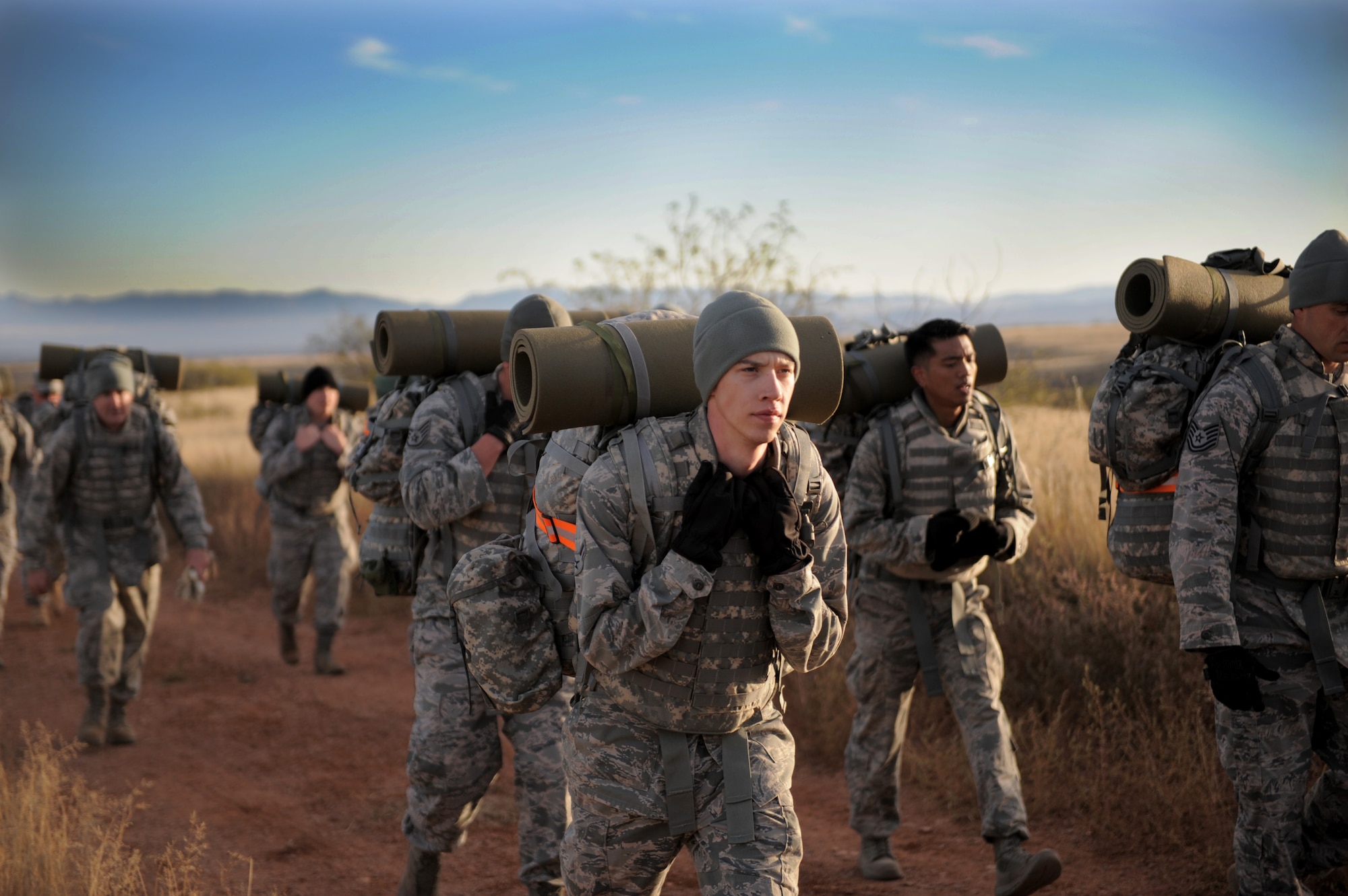 U.S. Air Force Airman 1st Class Koleton Mitchell, 25th Operational Weather Squadron weather forecaster, participates in a 7-mile-long ruck alongside fellow Airmen at Fort Huachuca, Ariz., Nov. 18, 2014. The ruck kicked-off a field training exercise culminating the Army Weather Support Course intended to integrate Airmen with Soldiers before they deploy with an Army unit. (U.S. Air Force photo by Airman 1st Class Chris Drzazgowski/Released)