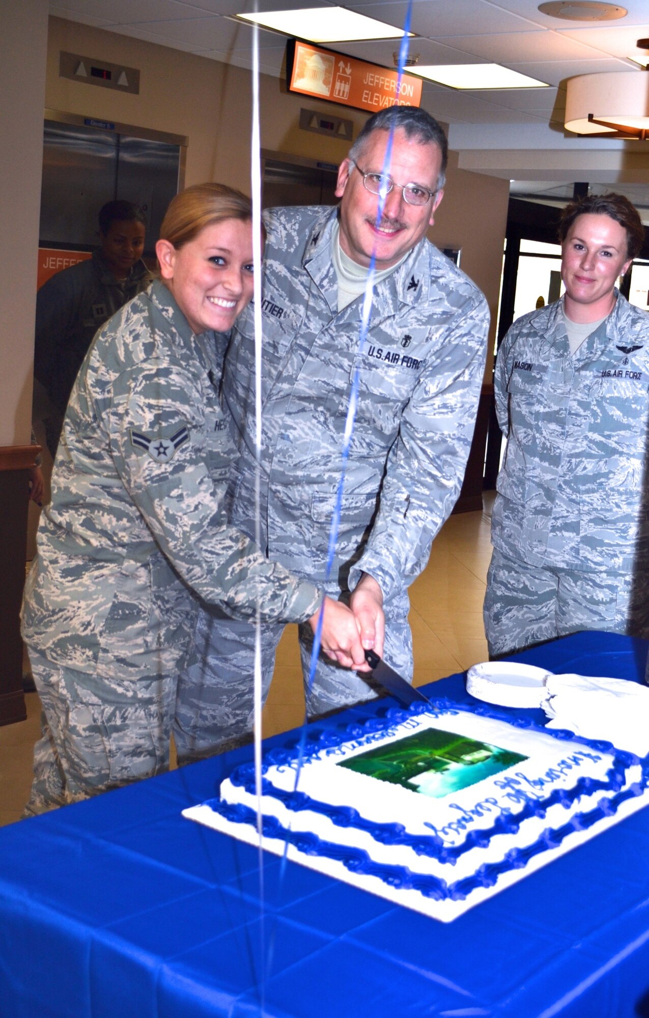 On Wednesday, Nov. 19 at 12:30, Malcolm Grow Medical Clinics and Surgery Center held a 127th birthday celebration to remember General Malcolm C. Grow who the medical facility is named for. The celebration was held in the main entrance, near the Malcolm Grow showcase. General Grow was the first surgeon general of the U.S. Air Force (July 1, 1949 - Nov. 30, 1949). Airman First Class Kelly Hecker, the youngest Airman present and Colonel Jay Cloutier, the oldest Airmen present cut the cake. (AF Photo by Master Sgt. Aimee Klarmann)