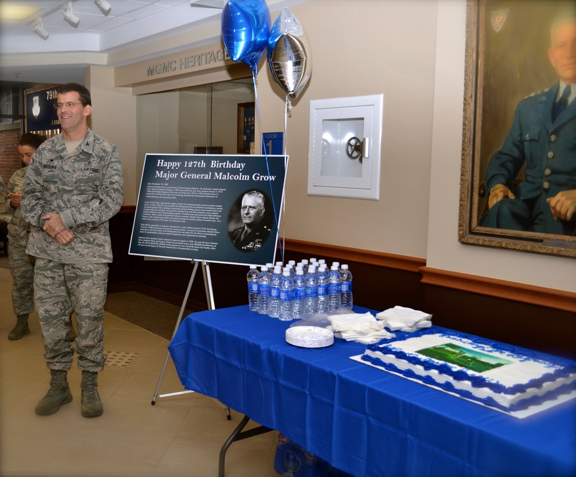 Colonel Thomas Cantilina, 779th Medical Group Commander welcomed guests on Wed., Nov. 19 to a historical birthday party. Malcolm Grow Medical Clinics and Surgery Center held a 127th birthday celebration to remember General Malcolm C. Grow who the medical facility is named for. The celebration was held in the main entrance, near the Malcolm Grow showcase. General Grow was the first surgeon general of the U.S. Air Force (July 1, 1949 - Nov. 30, 1949). (AF Photo by Master Sgt. Aimee Klarmann) 