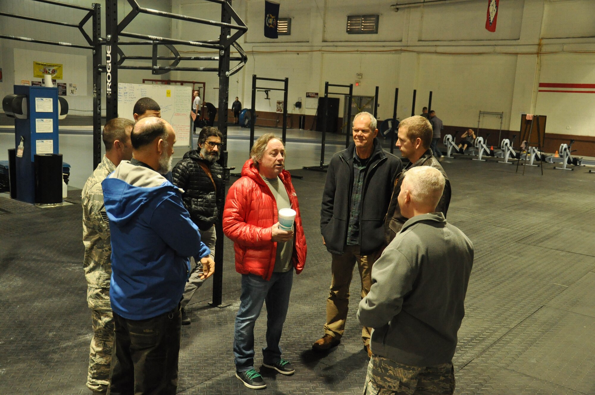 Coach Greg Glassman, founder and chief executive officer of CrossFit, and his team speaks with CrossFit Team Offutt Tactical Fitness coaches at the Offutt Field House Nov. 12. Glassman and his team visited with leadership from the Air Force Weather Agency, 55th Wing and U.S. Strategic Command and held four briefings for Team Offutt members during his two day visit. (U.S. Air Force photo by 2nd Lt. Carly A. Costello/Released)