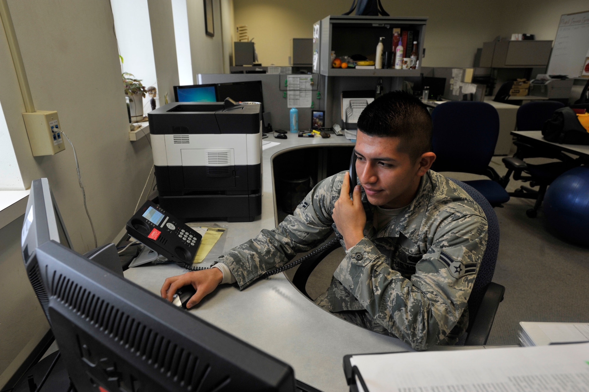 Airman 1st Class Roberto Ugalde-Velasco, a 92nd Logistics Readiness Squadron customer support specialist, assists a customer over the phone Nov. 20, 2014, at Fairchild Air Force Base, Wash. Ugalde-Velasco provides support to maintenance units to keep the KC-135 Stratotanker fully mission capable and able to provide air refueling. Ugalde-Velasco’s leadership selected him as a member of Team Fairchild’s elite, Fairchild’s Finest. (U.S. Air Force photo/Airman 1st Class Taylor Bourgeous)