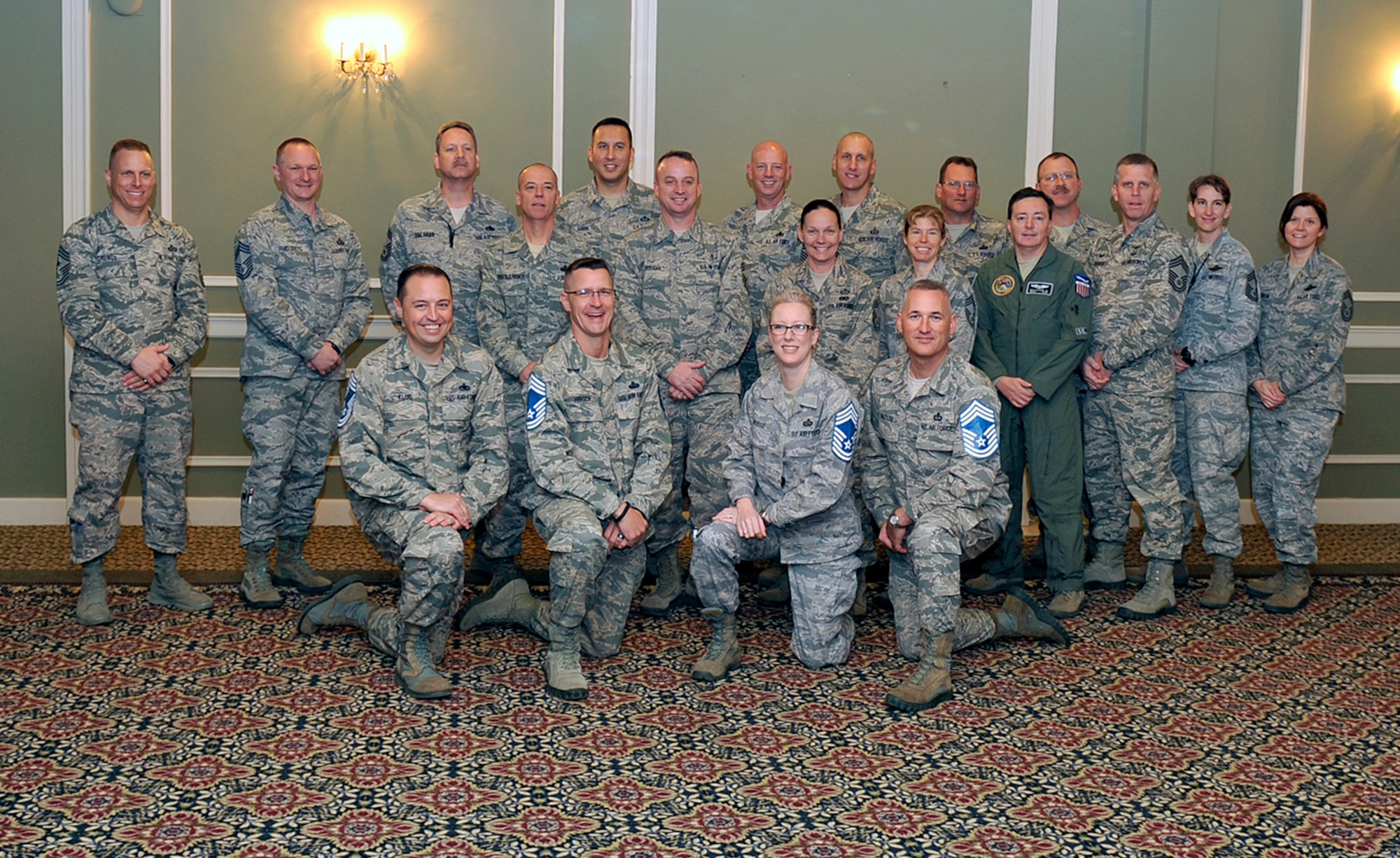 U.S. Air Force chief master sergeants from around Team Offutt pose for a photo with four chief selects at the Patriot Club, Nov. 20, Offutt Air Force Base, Neb. Nine senior master sergeants from Team Offutt were selected for promotion according to Air Force Personnel Center. (U.S. Air Force photo by Jeff W. Gates/Released)
