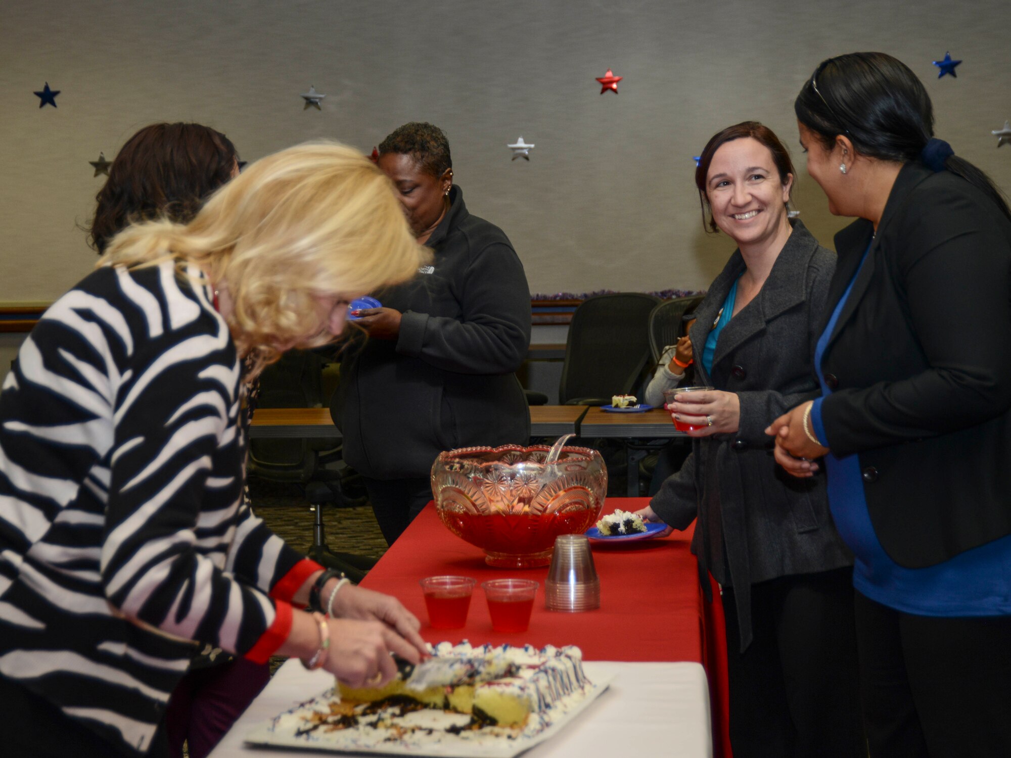Military members and their families were invited to the Airman and Family Readiness Center for a red, white and blue themed cake and punch social hour Nov. 20. (U.S. Air Force photo by Rebecca Amber) 
