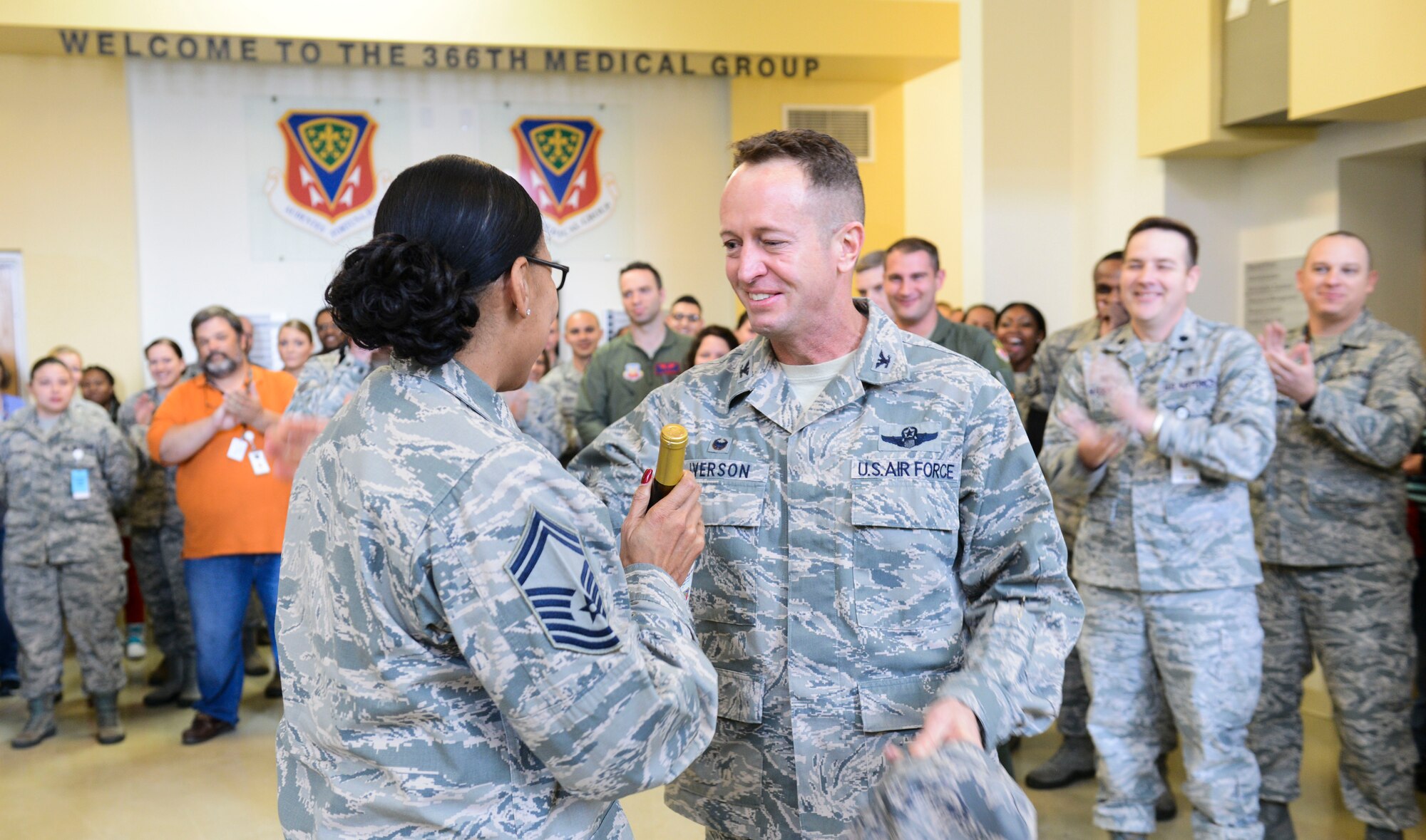 Col. David Iverson, 366th Fighter Wing commander, congratulates Senior Master Sgt. Rhonda Riggins, 366th Medical Operations Squadron superintendent, Nov. 20, 2014, at Mountain Home Air Force Base, Idaho. By congressional mandate only 1 percent of the enlisted force obtains the rank of chief. (U.S. Air Force photo by Airman 1st Class Malissa Lott/RELEASED)