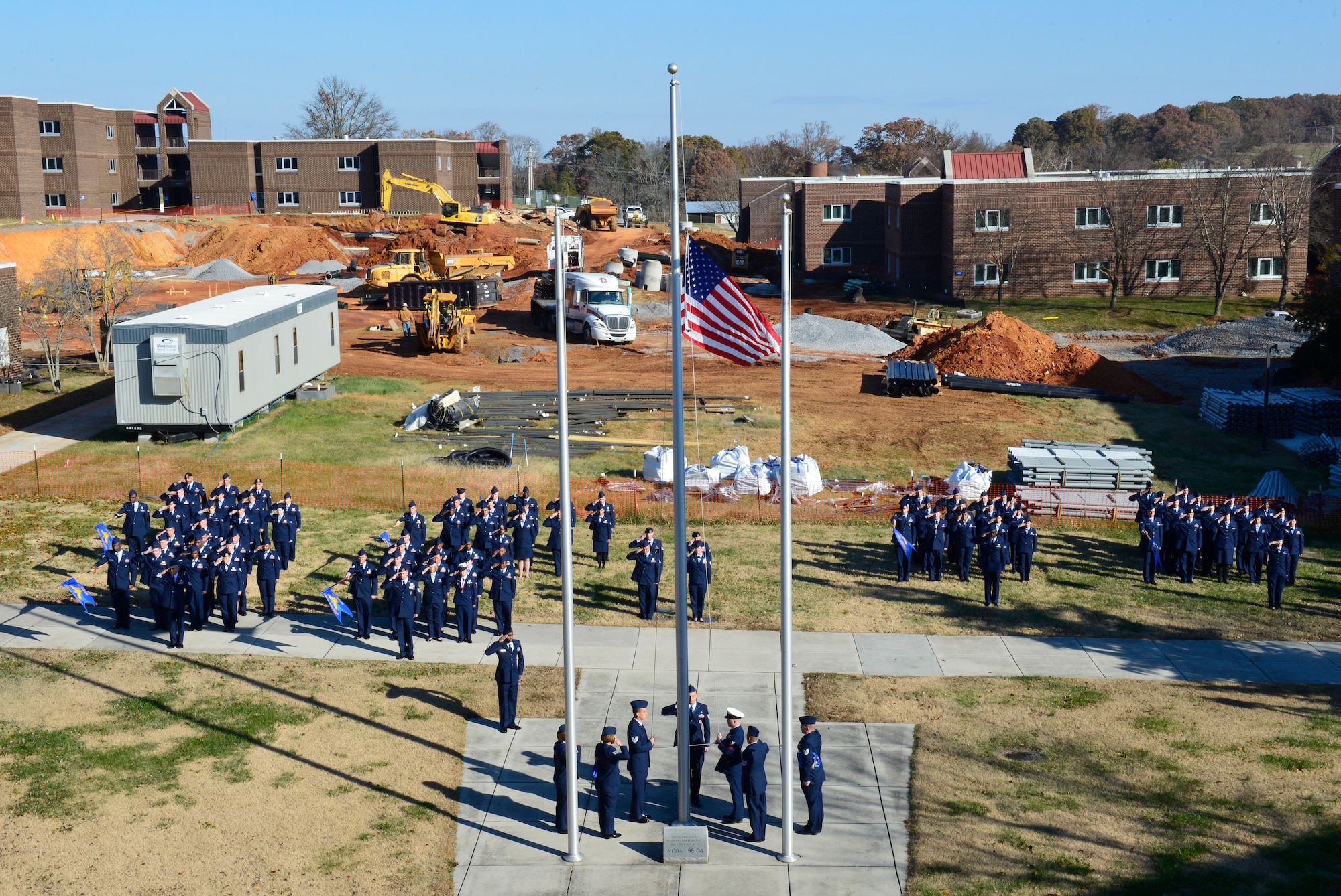 MCGHEE TYSON AIR NATIONAL GUARD BASE, Tenn. - Campus construction here  serves as the backdrop for a retreat ceremony with NCO Academy and Airman Leadership School graduates Nov. 20 at the I.G. Brown Training and Education Center. (U.S. Air National Guard photo by Master Sgt. Jerry Harlan/Released)