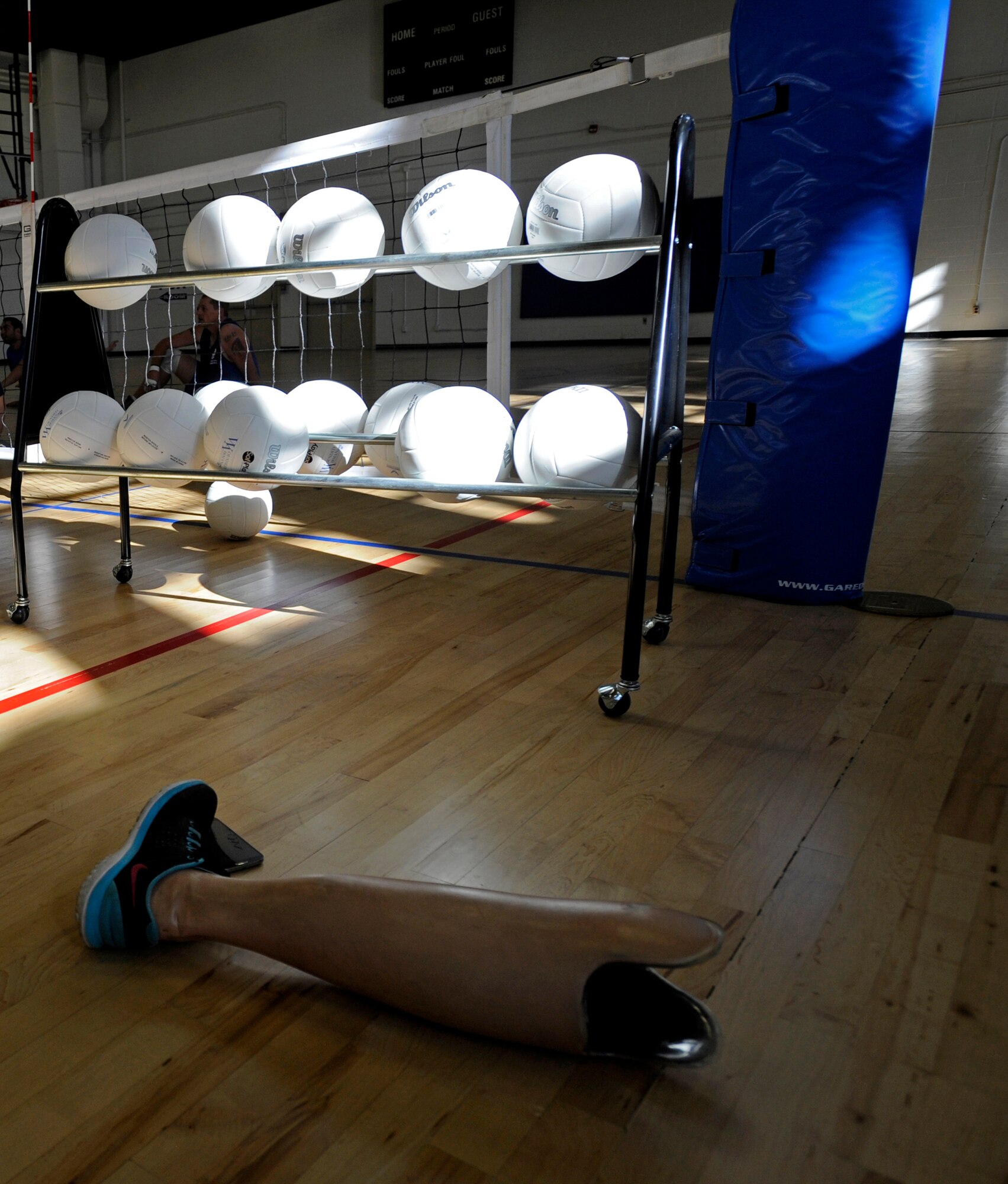 A prosthetic leg sits on the sideline as Air Force wounded, ill or injured warriors practice Nov. 18, 2014, at Joint Base Andrews, Md. (U.S. Air Force photo/Tech. Sgt. Brian Ferguson)