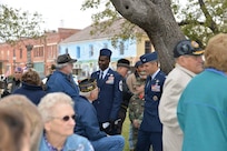 Chief Master Sgt. Troy Palmer, 12th Flying Training Wing command Chief, and Col. Matthew Isler, 12th FTW commander, talk with veterans during the city of Seguin's, Texas, annual Veterans Day ceremony.  Members from the 12th FTW participated in community Veterans Day events to express their support to veterans past, present and future and their families.  (U.S. Air Force photo by Laura McAndrews)