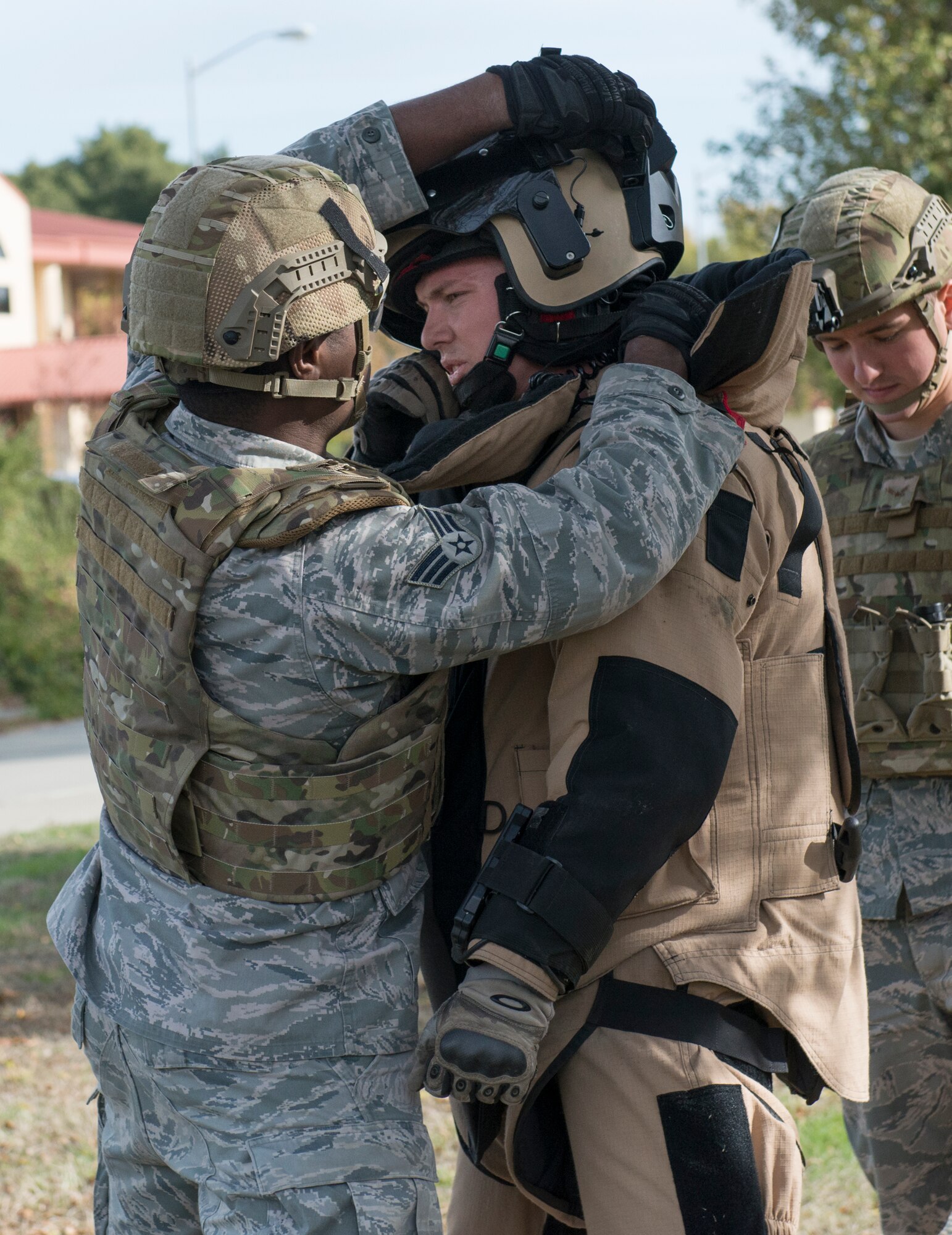 Travis Explosive Ordnance Disposal specialists prepare to evaluate a possible incendiary device that was left in an abandoned building during a base wide exercise Nov. 18, 2014, at Travis Air Force Base, California. The base wide scenario was played out in realistic, gritty detail, all in an effort to prepare emergency personnel and all Travis AFB employees for a potential crisis. (U.S. Air Force photo by Heide Couch)
