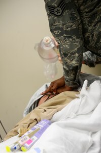 A U.S. Air Force Service member administers chest compressions during a lifesaver training at Langley Air Force Base, Va., Nov. 19, 2014. The 633rd Medical Group education and training section holds monthly Advanced Cardiac Life Support, Basic Life Support and Pediatric Advanced Life Support courses in order to provide medical professionals the most up-to-date lifesaving skills. (U.S. Air Force photo by Senior Airman Kayla Newman/Released)