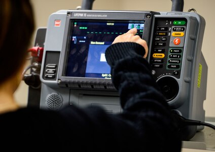 U.S. Air Force medical personnel practice the use of a defibrillator during a training course at Langley Air Force Base, Va., Nov. 19, 2014. Members of the 633rd Medical Group attended an Advanced Cardiac Life Saver course, which is offered monthly. (U.S. Air Force photo by Senior Airman Kayla Newman/Released)