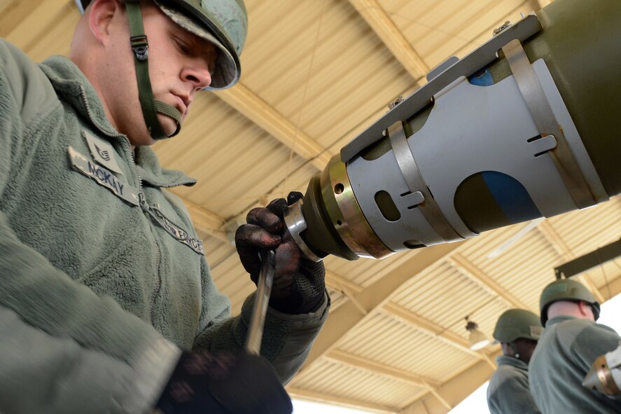 U.S. Air Force Tech. Sgt. Tony McKay, 20th Equipment Maintenance Squadron munitions flight munitions support equipment maintainer, tightens an arming wire on a MK-82 missile during a bomb build exercise at Shaw Air Force Base, S.C., Nov. 19, 2014. When the missile is dropped from an airplane and hits the ground, three explosions take place within the missile when it detonates. (U.S. Air Force photo by Senior Airman Ashley L. Gardner/Released)
