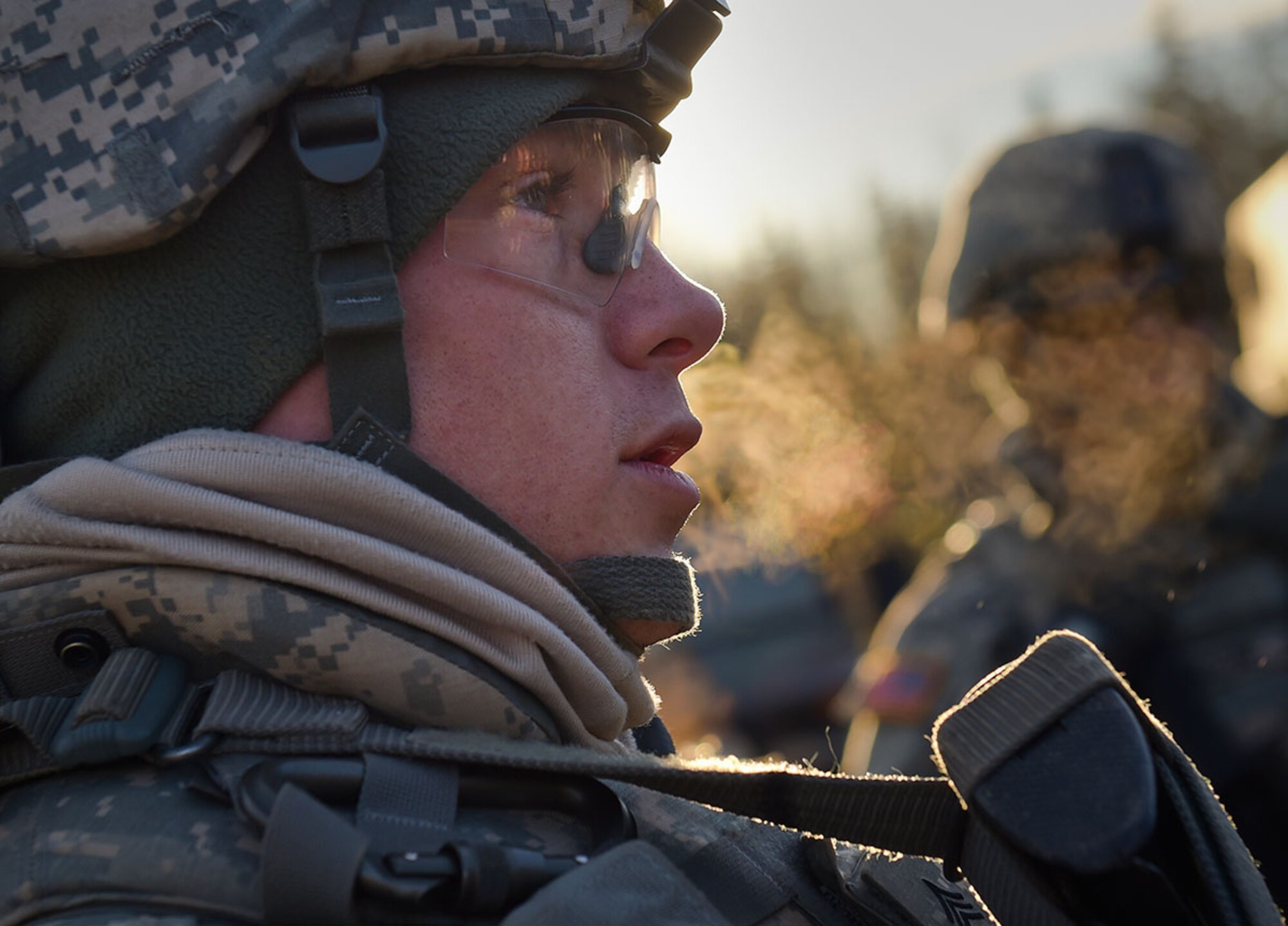 Army Sgt. Mark Morrison, a native of Lost Creek, W.V., listens to a briefing with his soldiers, assigned to U.S. Army Alaska's 109th Transportation Company, Thursday, Nov. 13, 2014, on Joint Base Elmendorf-Richardson, Alaska, in preparation for a convoy live-fire exercise. The soldiers also simultaneously executed react-to-ambush procedures with follow-on hasty and deliberate vehicle recovery operations. (U.S. Air Force photo/Justin Connaher)