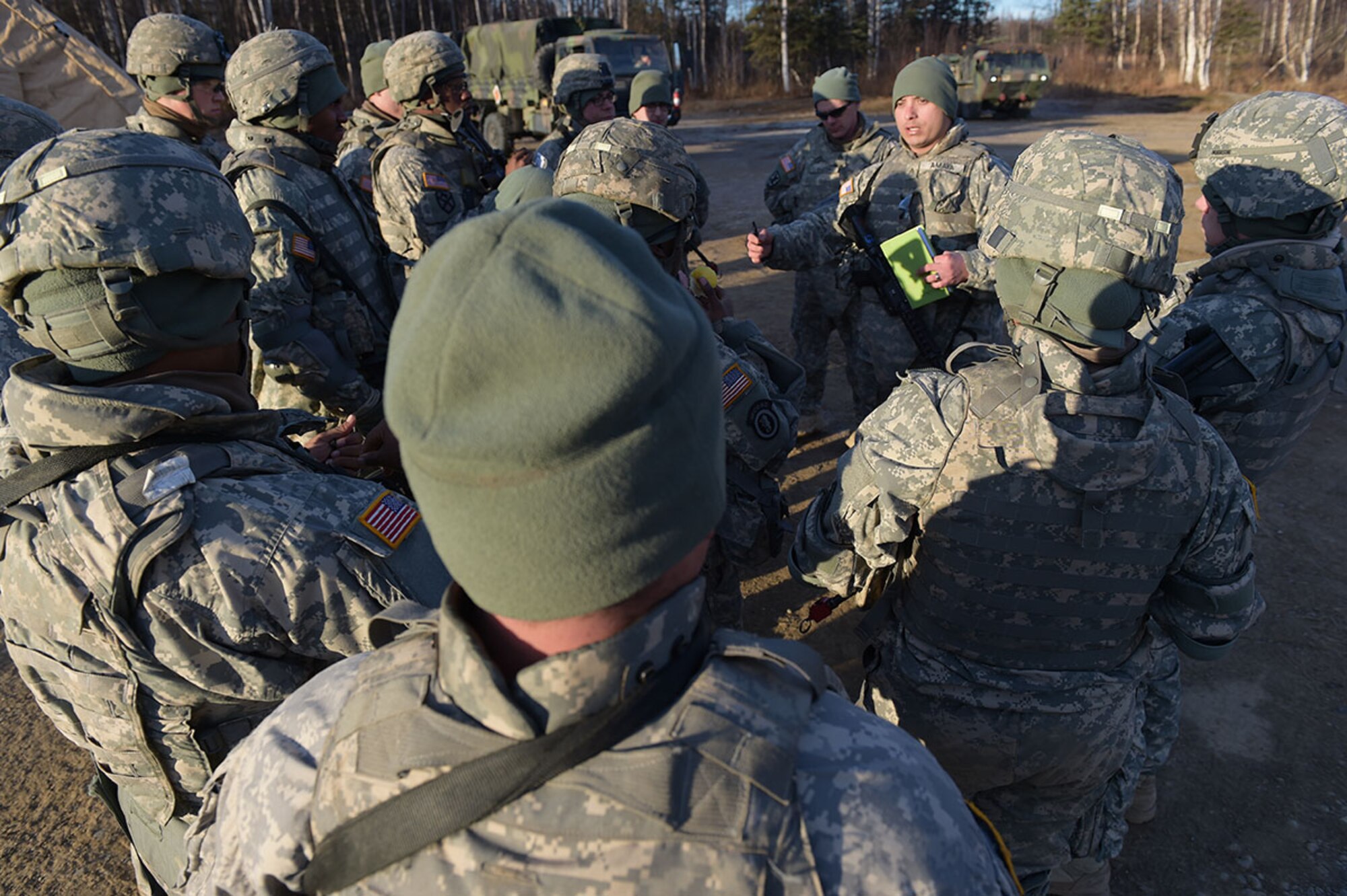 Army Sgt. Adrian Amaya, a native of Hebbronville, Texas, assigned to U.S. Army Alaska's 109th Transportation Company, briefs his soldiers, Thursday, Nov. 13, 2014, on Joint Base Elmendorf-Richardson, Alaska, in preparation for a convoy live-fire exercise. The soldiers also simultaneously executed react-to-ambush procedures with follow-on hasty and deliberate vehicle recovery operations. (U.S. Air Force photo/Justin Connaher)