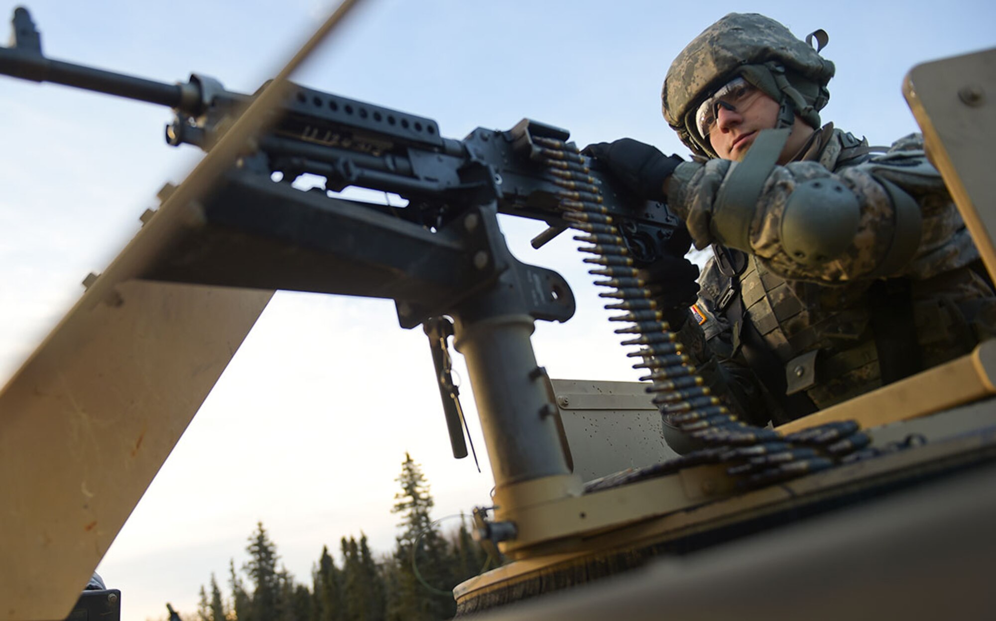 Army Pvt. Phillip Richter, assigned to U.S. Army Alaska's 109th Transportation Company, provides security, Thursday, Nov. 13, 2014, on Joint Base Elmendorf-Richardson, Alaska, during a convoy live-fire exercise.  The soldiers also simultaneously executed react-to-ambush procedures with follow-on hasty and deliberate vehicle recovery operations.  (U.S. Air Force photo/Justin Connaher)