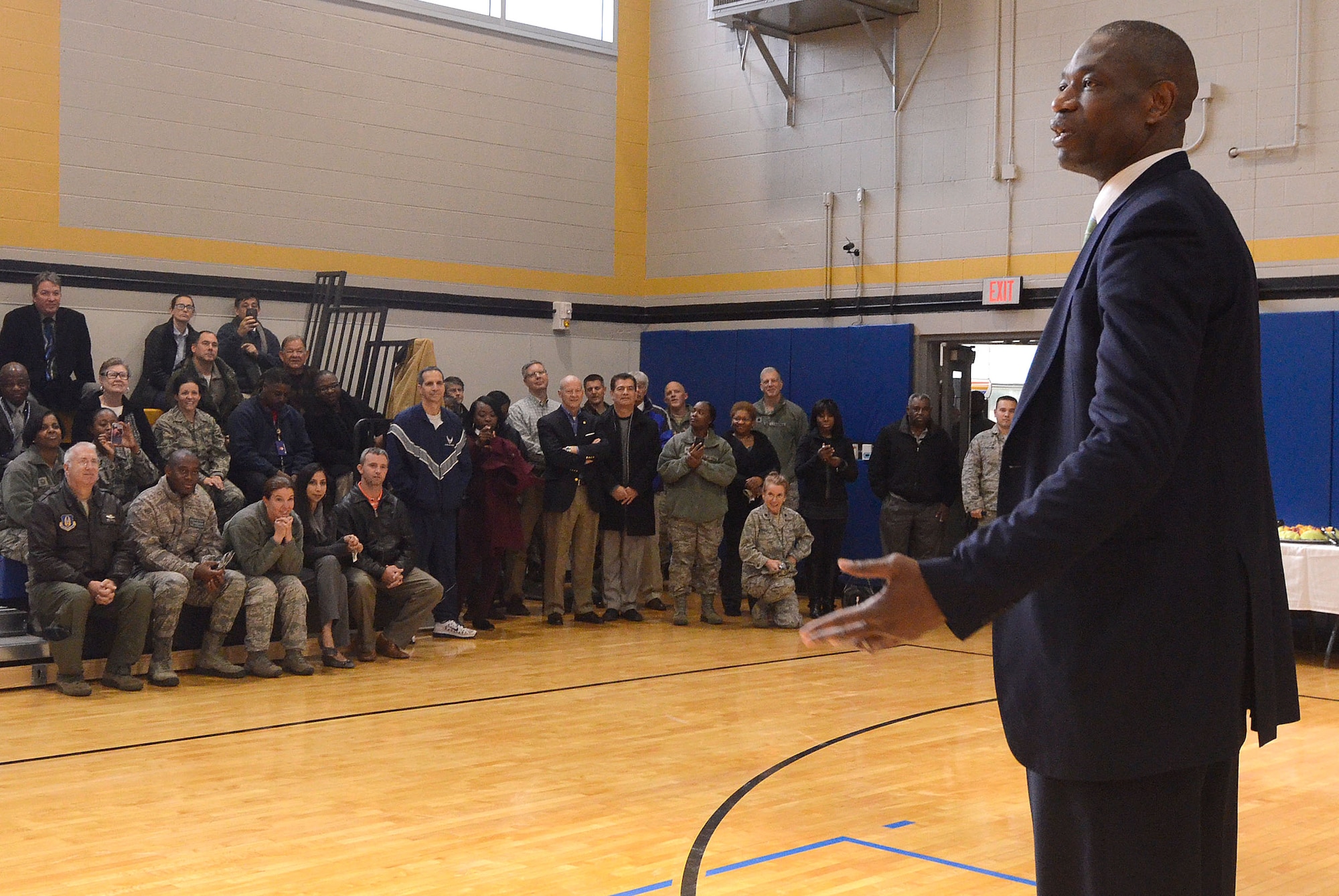 Dikembe Mutombo, NBA Hall of Famer, speaks to members of Team Dobbins at the grand opening of the renovated fitness center at Dobbins Air Reserve Base, Ga. Nov. 18, 2014. The fitness center includes approximately 30 new pieces of equipment. (U.S. Air Force photo by Don Peek/Released)