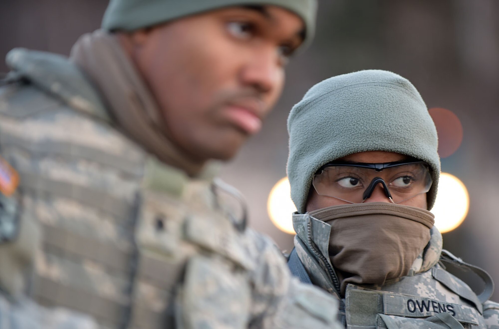 Army Private Cheyenne Owens, a native of Toledo, Ohio, listens during to a briefing with fellow soldiers from U.S. Army Alaska's 109th Transportation Company, Thursday, Nov. 13, 2014, on Joint Base Elmendorf-Richardson, Alaska, in preparation for a convoy live-fire exercise. The soldiers also simultaneously executed react-to-ambush procedures with follow-on hasty and deliberate vehicle recovery operations.  (U.S. Air Force photo/Justin Connaher)