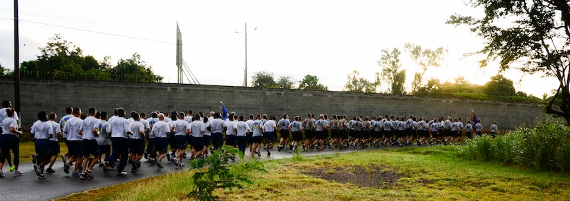 Members of Joint Task Force-Bravo run in formation during the quarterly JTF-Bravo four-mile run at Soto Cano Air Base, Honduras, Nov. 21, 2014.  Once a quarter JTF-Bravo holds a formation run to encourage esprit de corps and physical fitness. (U.S. Air Force photo/Tech. Sgt. Heather Redman)