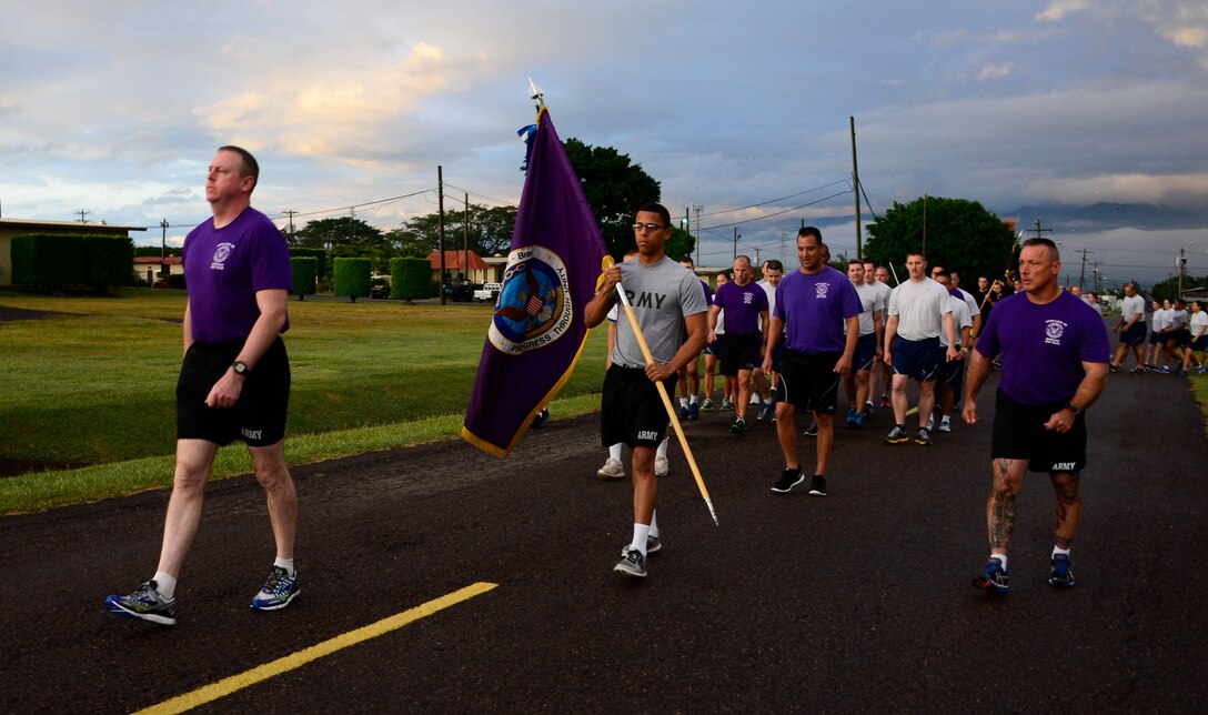 U.S. Army Col. Kirk Dorr, Joint Task Force-Bravo commander, leads the formation during the quarterly JTF-Bravo four-mile run at Soto Cano Air Base, Honduras, Nov. 21, 2014.  Once a quarter JTF-Bravo holds a formation run to encourage esprit de corps and physical fitness. (U.S. Air Force photo/Tech. Sgt. Heather Redman)