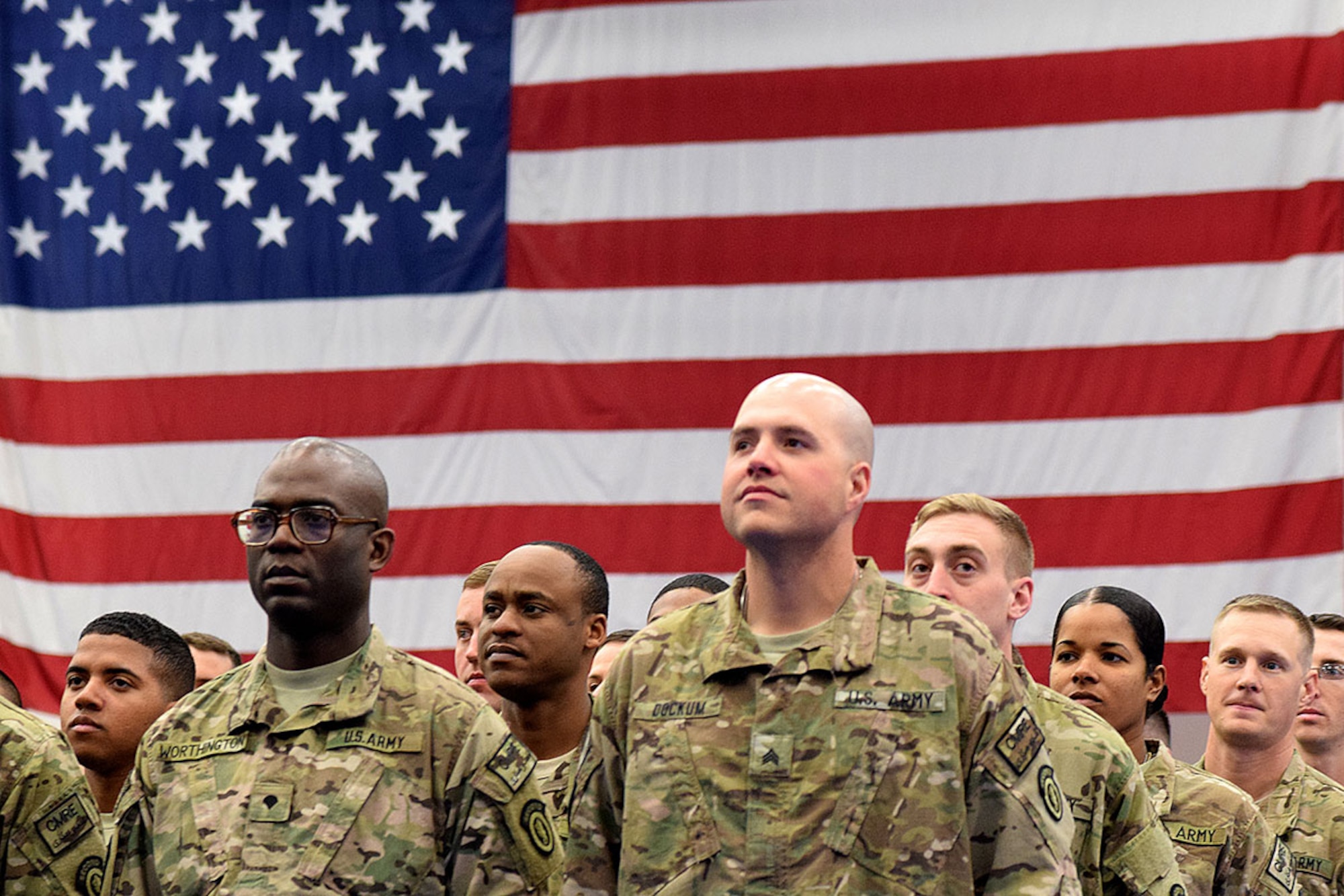 Returning soldiers from the 17th Combat Sustainment Support Battalion wait for the chance to reunite with their friends and family at the Buckner Physical Fitness Center on Joint Base Elmendorf-Richardson Nov. 18, 2014. About 150 soldiers from the 23rd Sapper Company and 17th CSSB were met by their families and friends after the soldiers returned from Afghanistan. (Army photo/John Pennell)