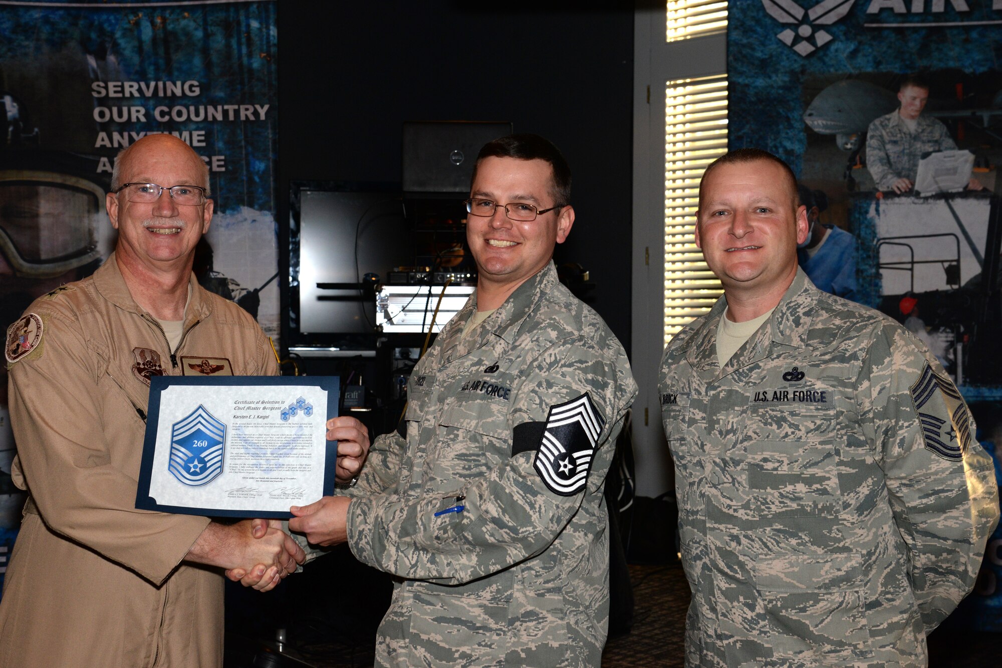 U.S. Air Force Senior Master Sgt. Karsten Kargel, U.S. Air Forces Central fuels superintendent, receives his chief master sergeant select promotion certificate from Maj. Gen. Mark Kraus, Air National Guard assistant to the Combined Forces Air Component Commander at Shaw Air Force Base, S.C., Nov. 20, 2014. Kargel was one of the 479 Airmen across the Air Force selected for promotion to chief. (U.S. Air Force photo by Airman 1st Class Jonathan Bass/Released)