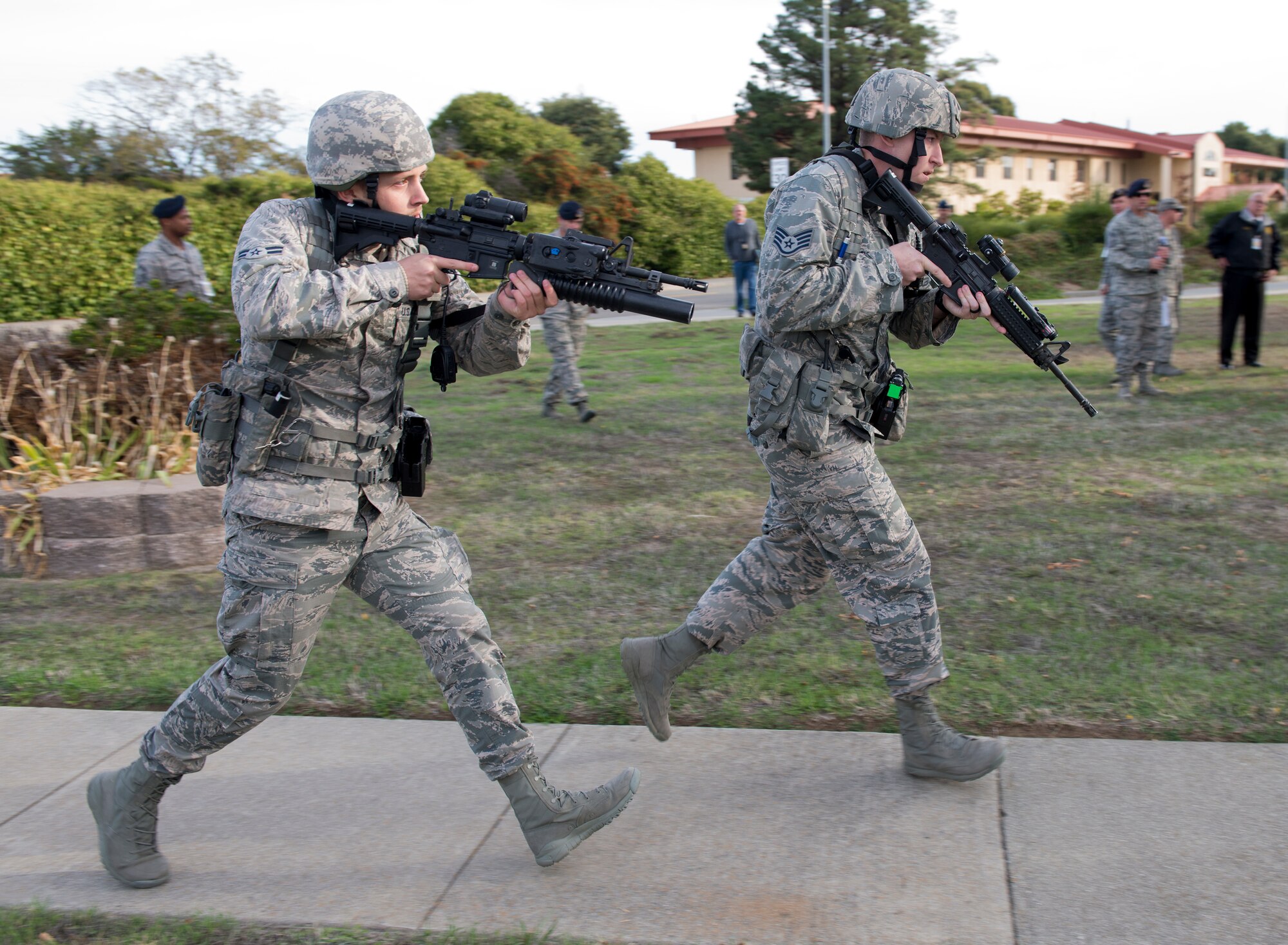 Airmen from the 60th Security Forces Squadron respond to an active-shooter exercise Nov. 18, 2014, at Travis Air Force Base, California. Travis members tested their preparedness during a simulated active-shooter exercise at vacant Bldg. 235. The base wide scenario was played out in a realistic, gritty detail, all in effort to prepare emergency personnel and all Travis employees for a potential crisis. (U.S. Air Force photo by Heide Couch)