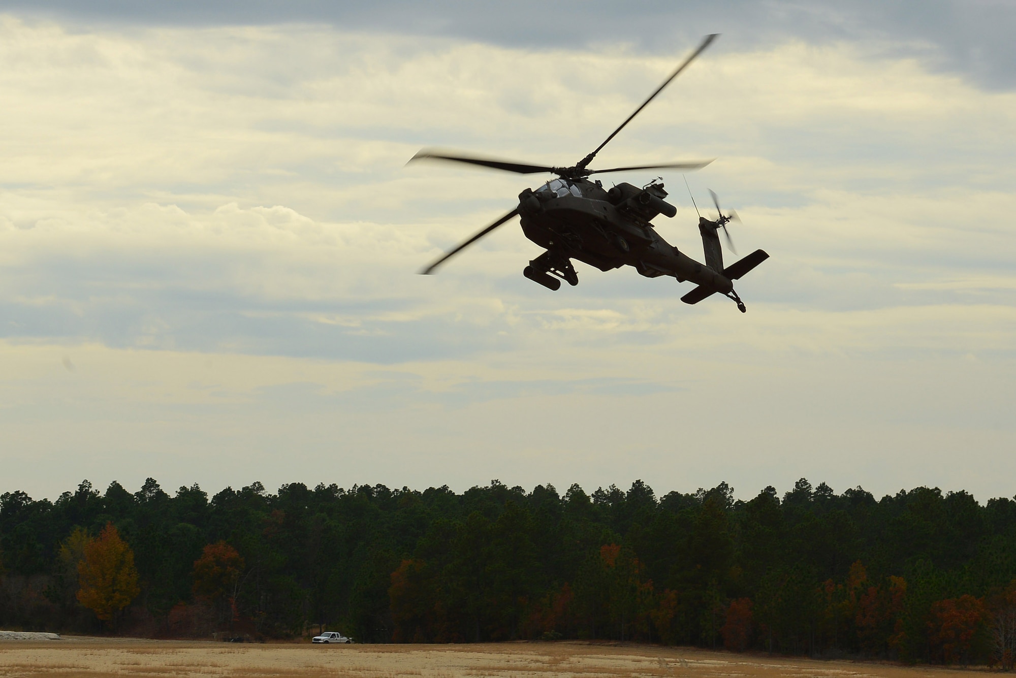 An AH-64 Apache assigned to the 1-130 Attack Recon Battalion, North Carolina Army National Guard, based at the Raleigh-Durham International Airport, trains at Poinsett Electronic Combat Range, Sumter, S.C., Nov. 13, 2014. Poinsett Range provides electronic warfare training, munition training, Tactical Air Control Party training, land navigation training, and survival, evasion, resistance, escape training. (U.S. Air Force photo by Airman 1st Class Diana M. Cossaboom/Released)