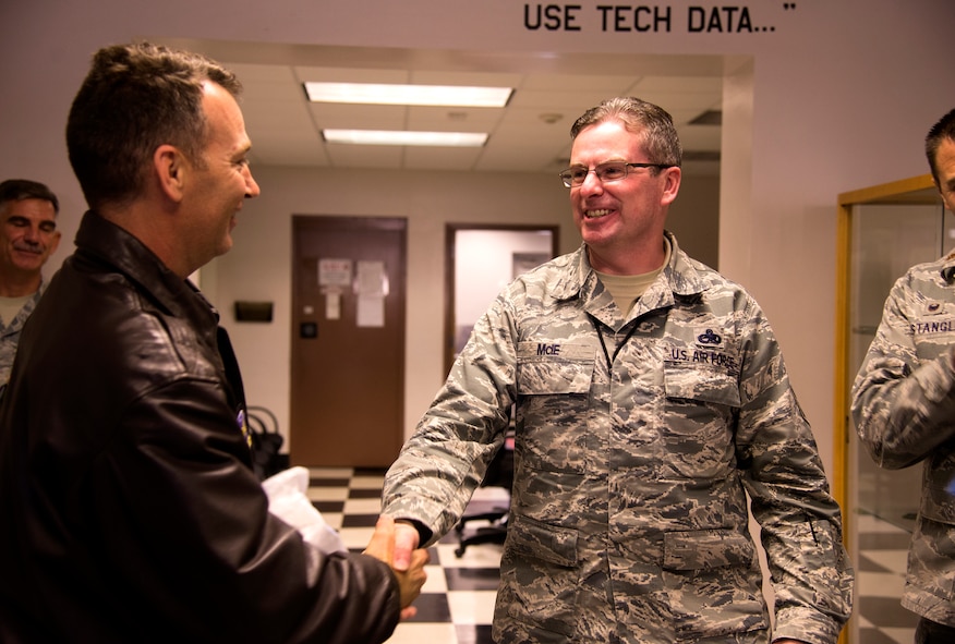 U.S. Air Force Col. Chad Franks, 23d Wing commander, tells Senior Master Sgt. James McIe, 75th Aircraft Maintenance Unit superintendent, he was selected to promote to chief master sergeant at Moody Air Force Base, Ga., Nov. 19, 2014. Chief master sergeant is the highest Air Force enlisted rank and makes up one percent of its enlisted force. (U.S. Air Force photo by Senior Airman Sandra Marrero/Released)
