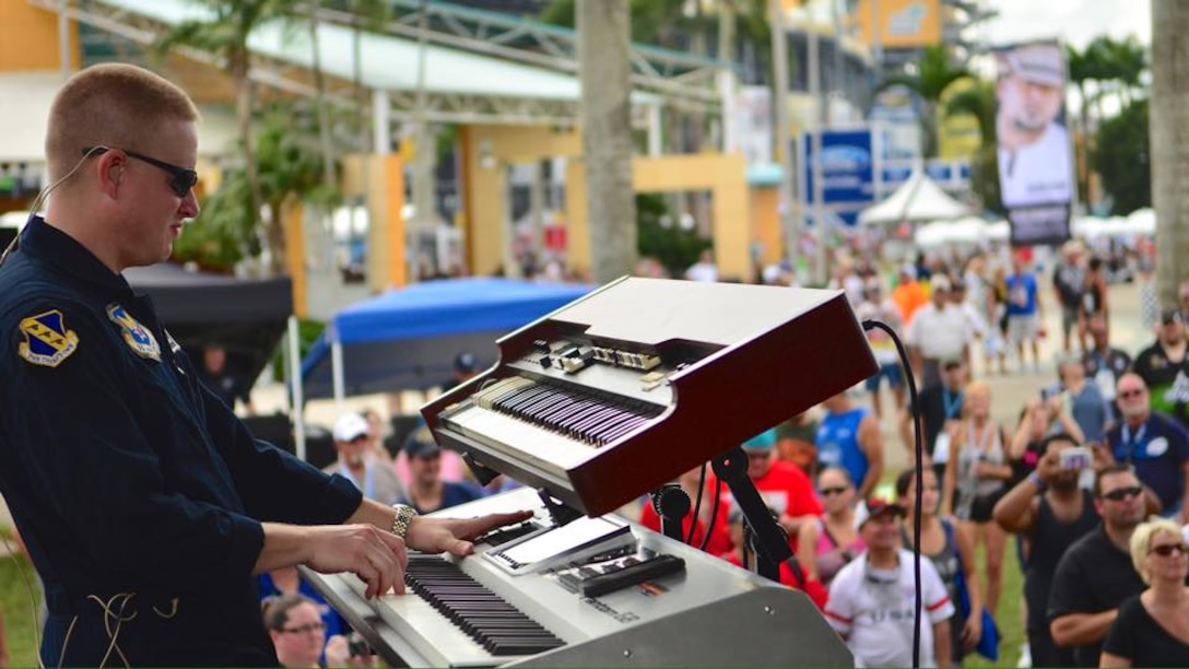 Master Sergeant Jonathan McPherson performs on keyboards for a recent performance at Homestead-Miami Speedway.  NASCAR crowds enjoyed shows from Max Impact for three consecutive days. (U.S. Air Force Photo/released)