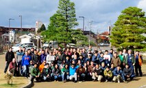 Volunteers from the U.S. Air Force, Japan Air Self-Defense Force, and Kinki-Chubu Defense Bureau gathered for a group photo after cleaning a park in Komatsu, Japan, Nov. 15, 2014. The volunteers used their day off to give back to the community by picking up trash, raking leaves, sweeping sidewalks and cleaning gutters at a local park. The 35th Fighter Wing from Misawa Air Base, Japan was at Komatsu Air Base for an Aviation Training Relocation Program. The 212th Rescue Squadron from Joint Base Elmendorf-Richardson, Alaska and the 33rd RQS from Kadena Air Base, Japan were at Komatsu Air Base for exercise Keen Sword. The joint training conducted during exercise Keen Sword and in the ATR developed bilateral working relationships and allowed for the practice and evaluation of coordination procedures and interoperability elements required to respond to the defense of Japan, or to a regional crisis. (U.S. Air Force photo by 2nd Lt. Erik Anthony/Released)