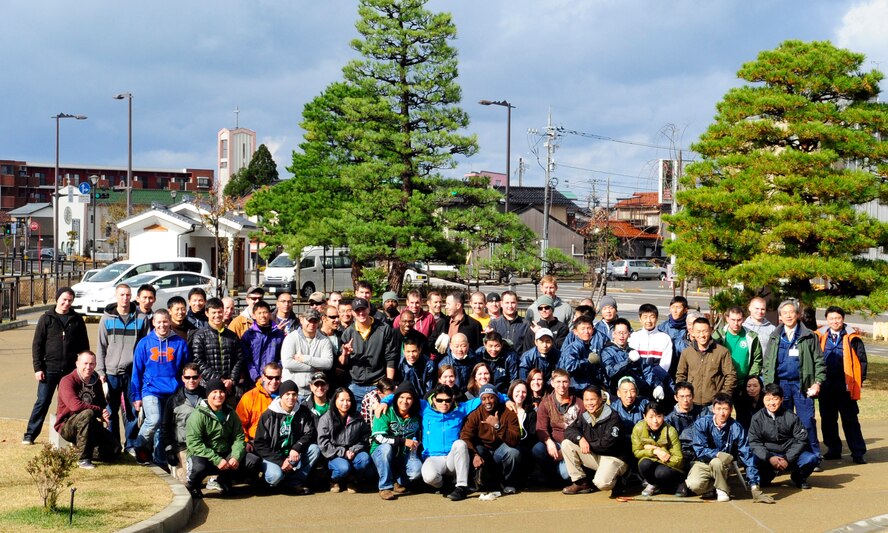 Volunteers from the U.S. Air Force, Japan Air Self-Defense Force, and Kinki-Chubu Defense Bureau gathered for a group photo after cleaning a park in Komatsu, Japan, Nov. 15, 2014. The volunteers used their day off to give back to the community by picking up trash, raking leaves, sweeping sidewalks and cleaning gutters at a local park. The 35th Fighter Wing from Misawa Air Base, Japan was at Komatsu Air Base for an Aviation Training Relocation Program. The 212th Rescue Squadron from Joint Base Elmendorf-Richardson, Alaska and the 33rd RQS from Kadena Air Base, Japan were at Komatsu Air Base for exercise Keen Sword. The joint training conducted during exercise Keen Sword and in the ATR developed bilateral working relationships and allowed for the practice and evaluation of coordination procedures and interoperability elements required to respond to the defense of Japan, or to a regional crisis. (U.S. Air Force photo by 2nd Lt. Erik Anthony/Released)